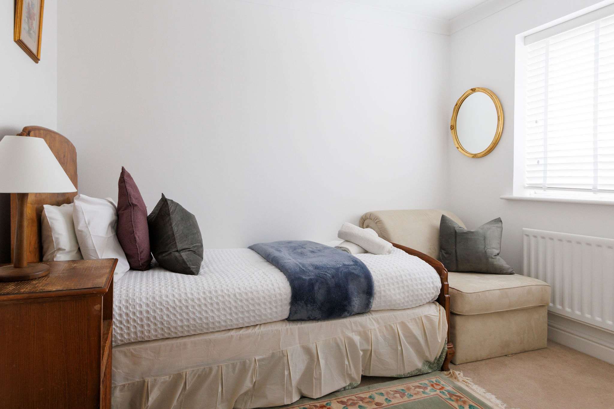 The small sofa bed in the fourth bedroom