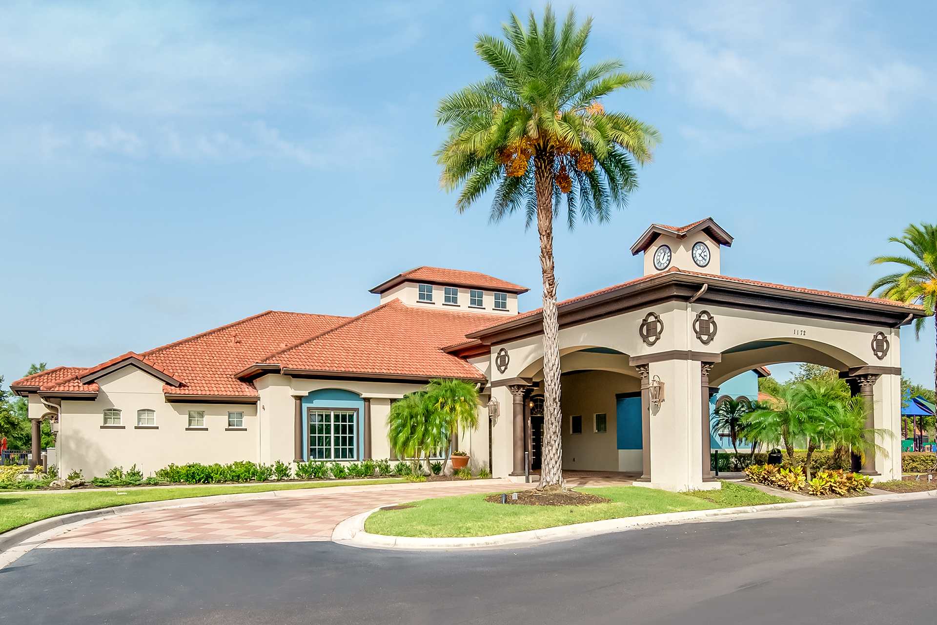 Beautiful Entrance Featuring A Grand Waterfall And Palm Trees
