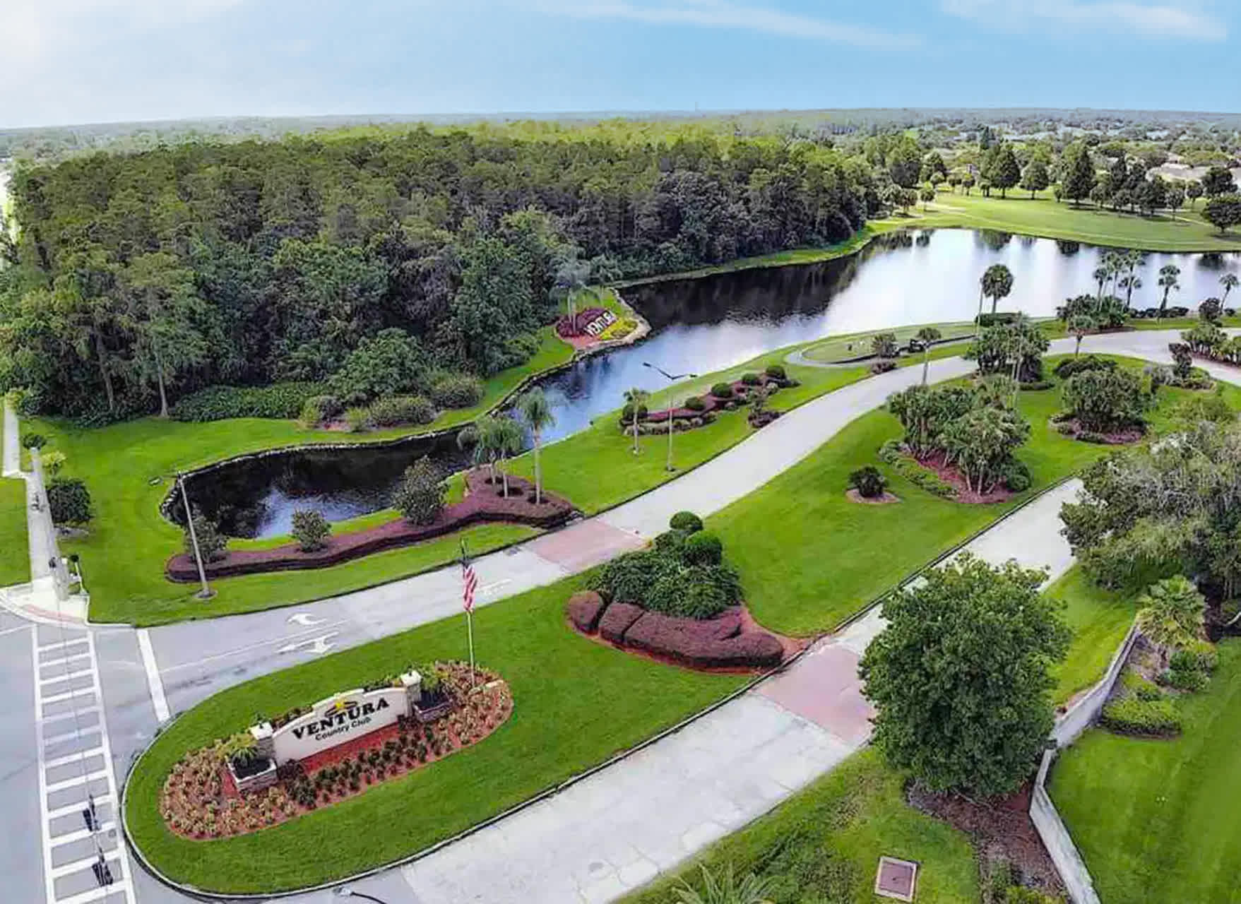 Beautiful Golf Course Surrounded By Lush Palm Trees And Scenic Views
