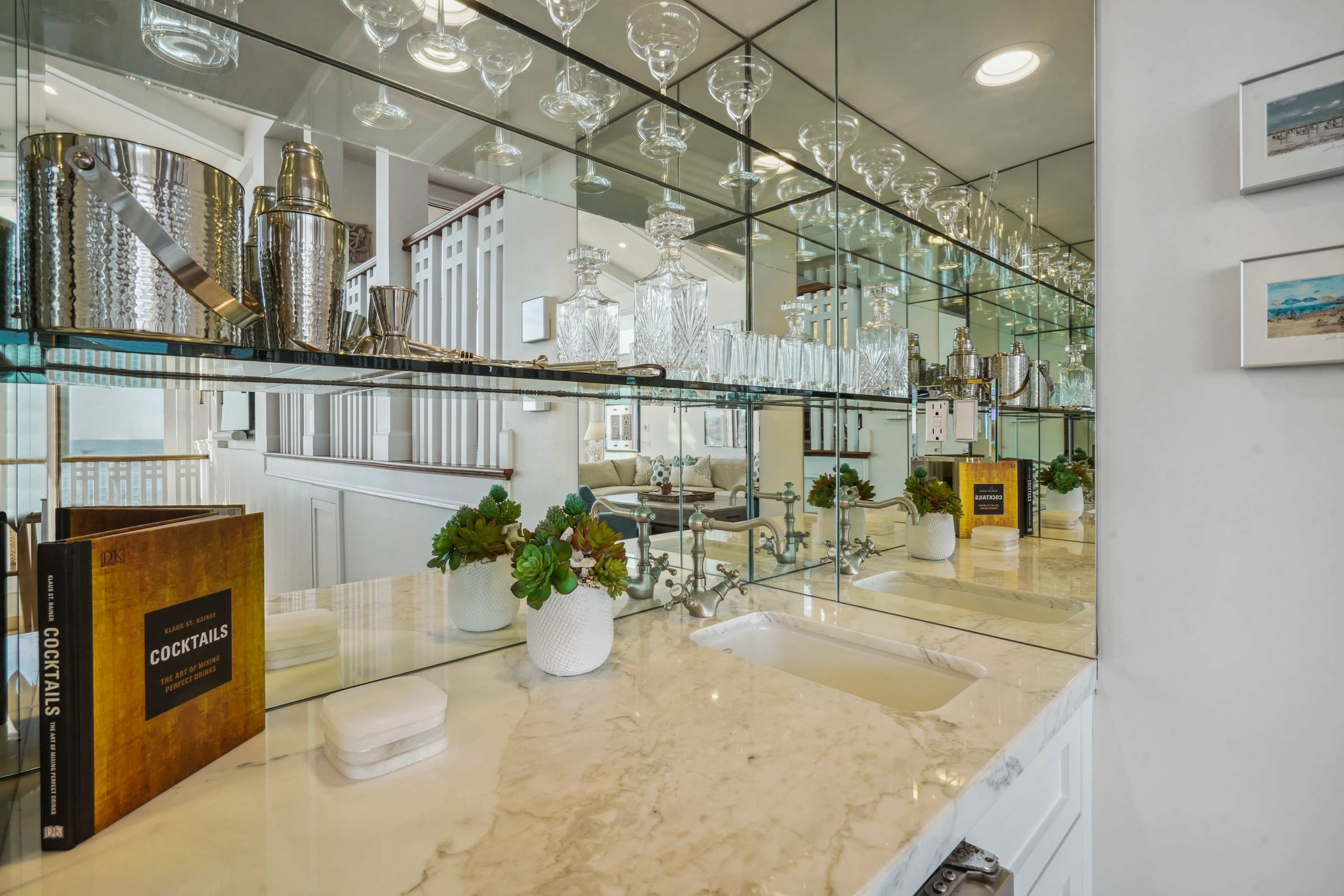 Sip in style with a mirrored bar that reflects the elegance of Malibu.