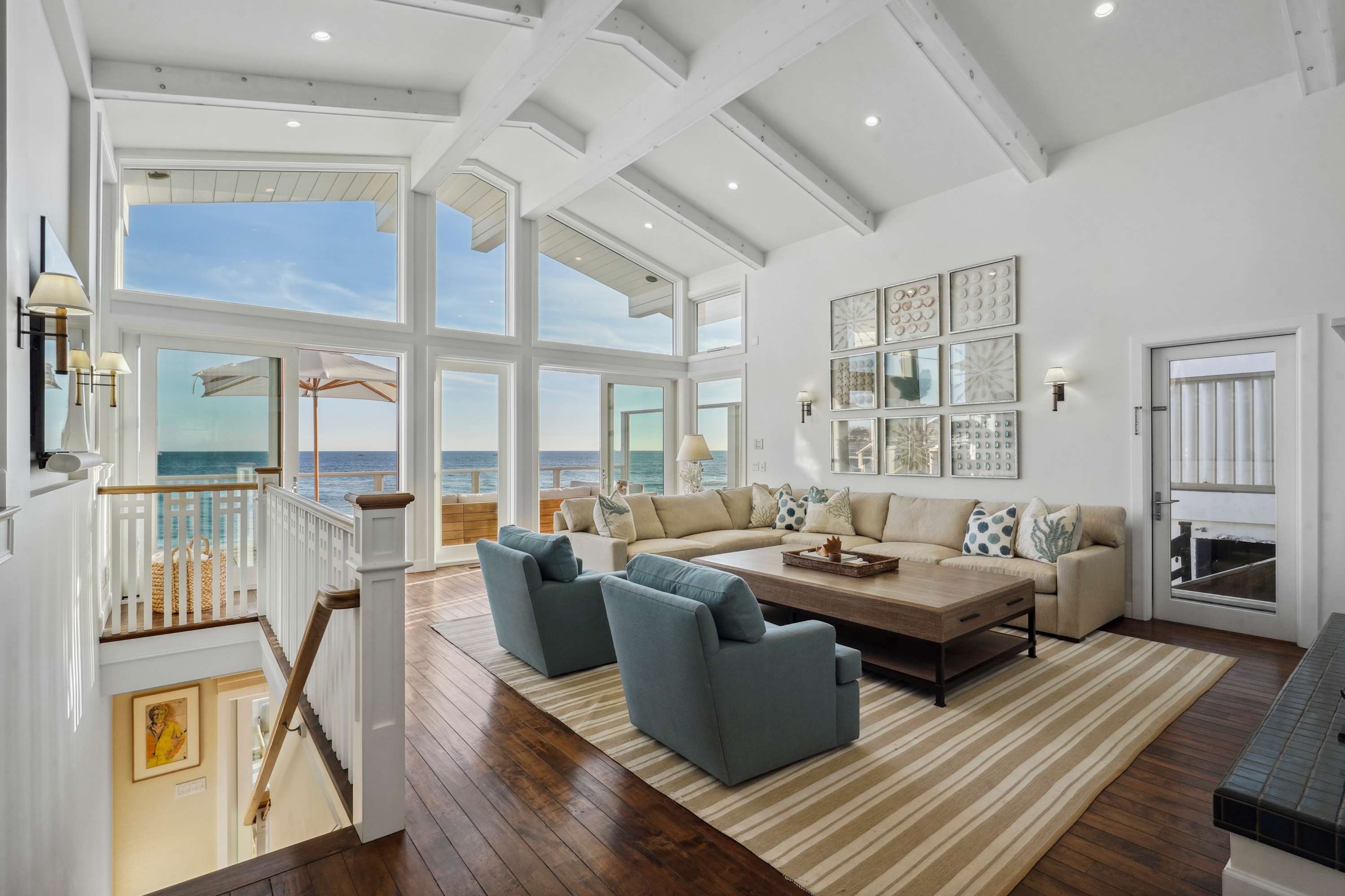 Floor-to-ceiling windows open to endless horizons.