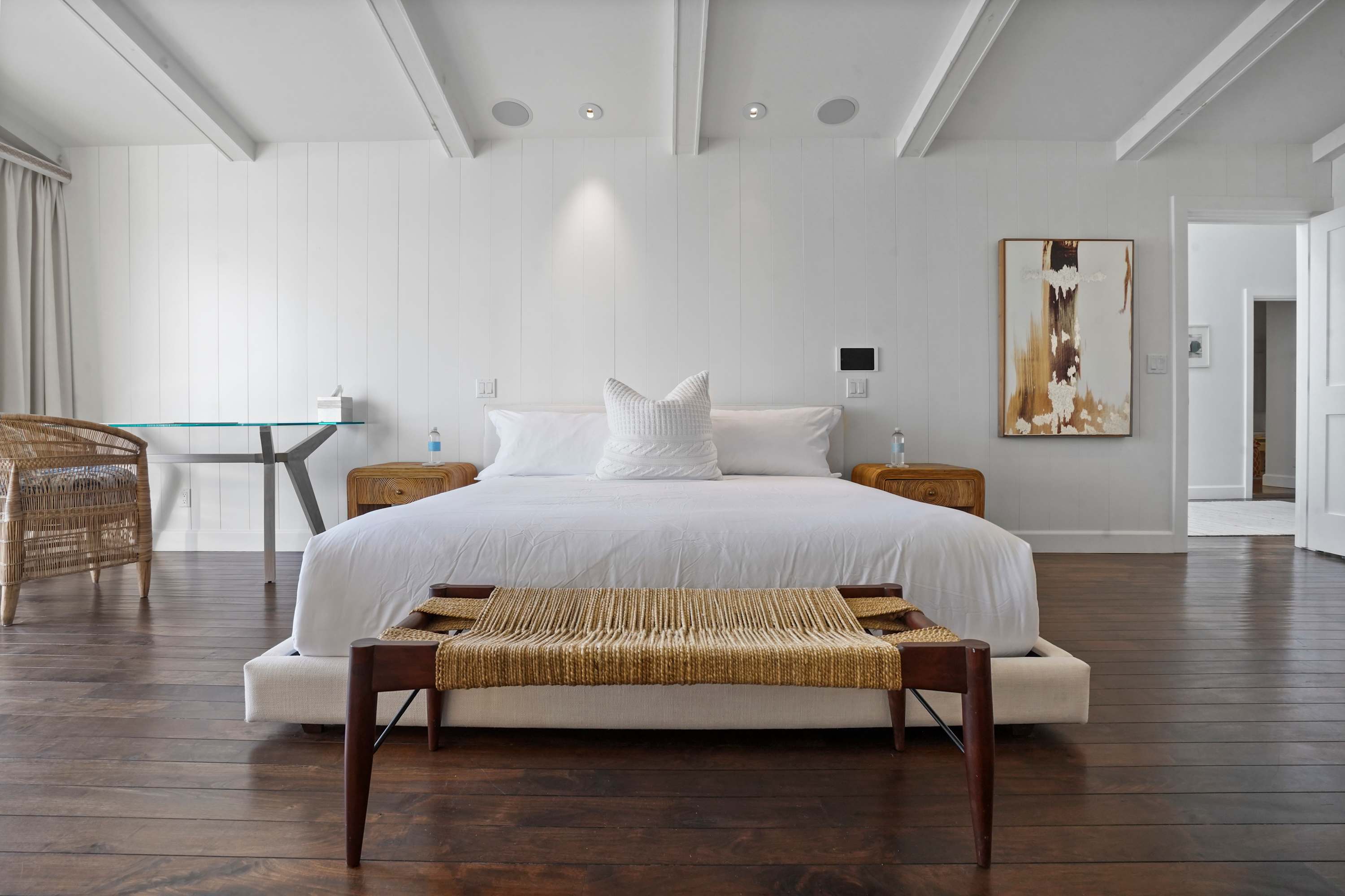 Drift into comfort on a bed framed by artisanal craftsmanship.