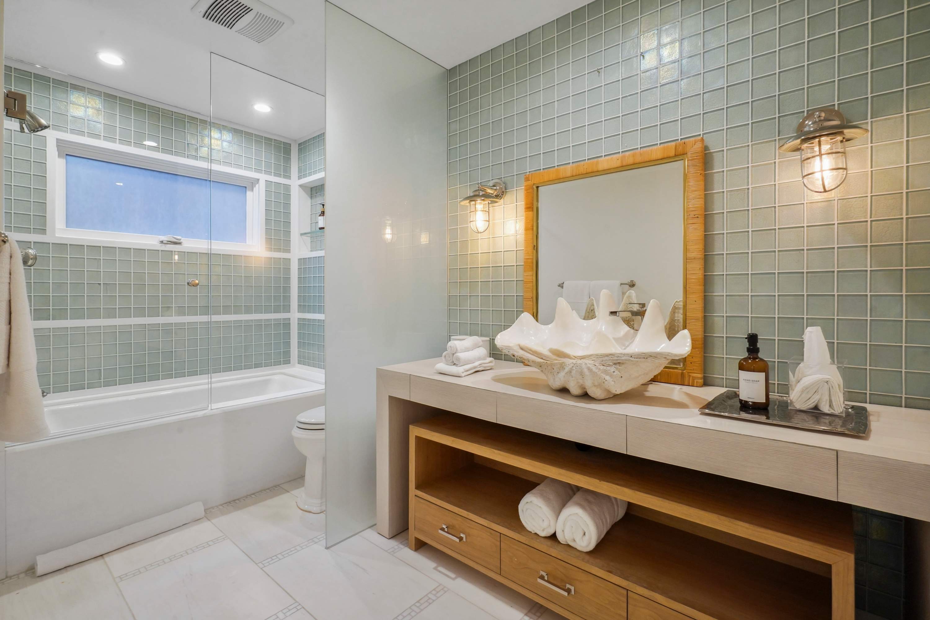 Coastal charm is alive in every detail of this serene retreat.