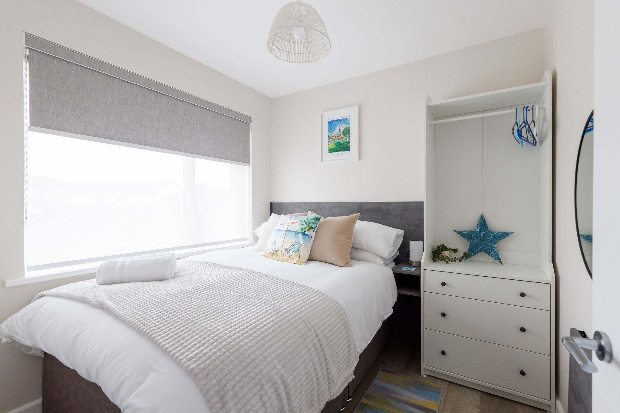 This double bedroom has a comfy bed and plenty of storage for belongings.