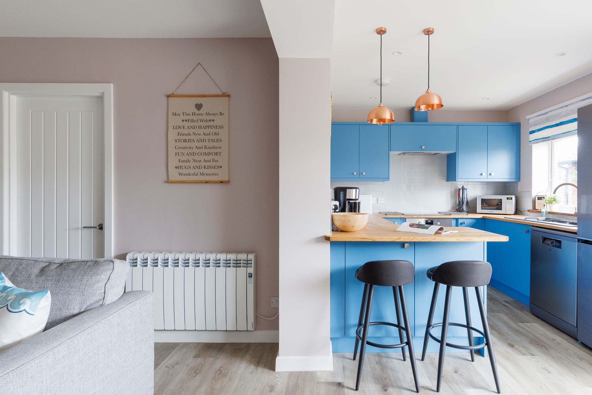 There is additional seating at the kitchen's breakfast bar.