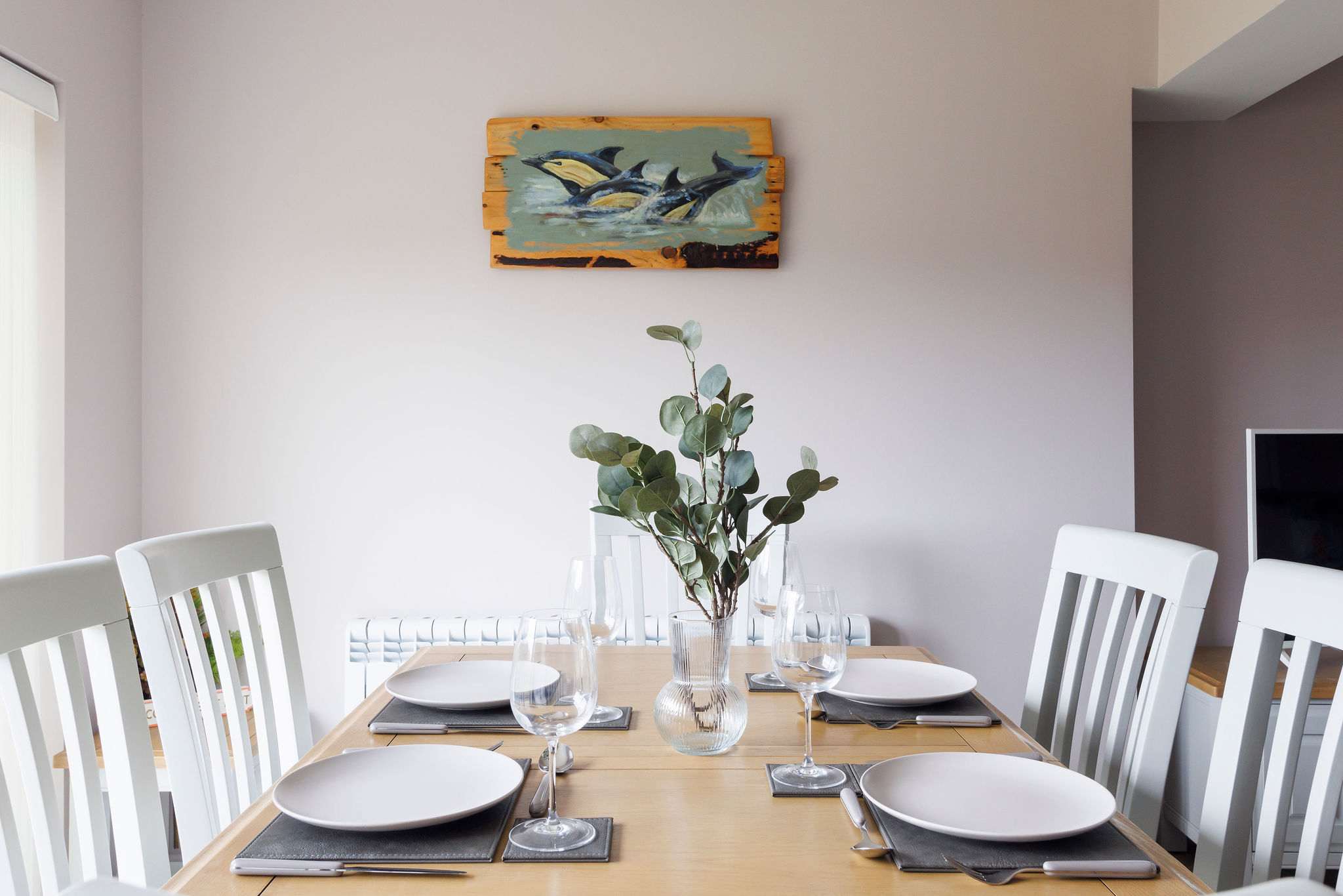 The dining area has table and chairs to seat up to 6 guests.