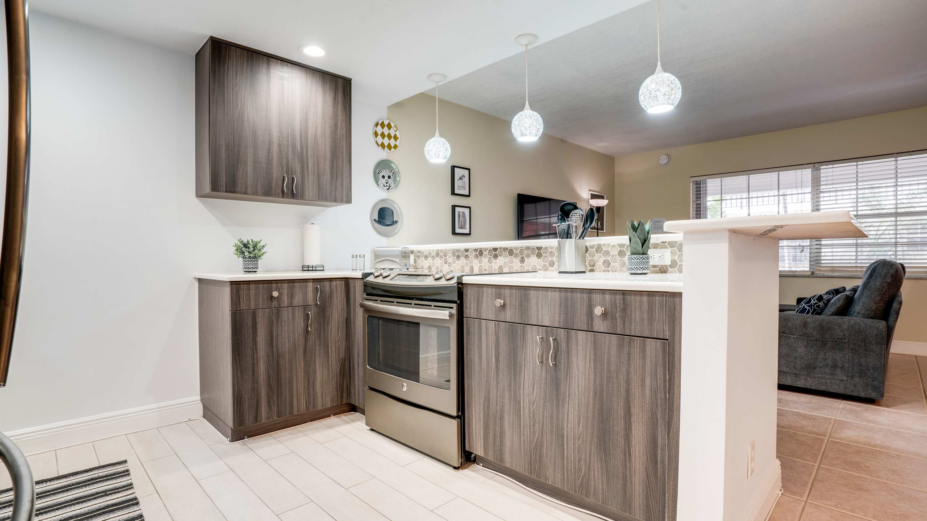 Sleek and modern kitchen with stylish cabinetry and ambient lighting, perfect for culinary adventures.