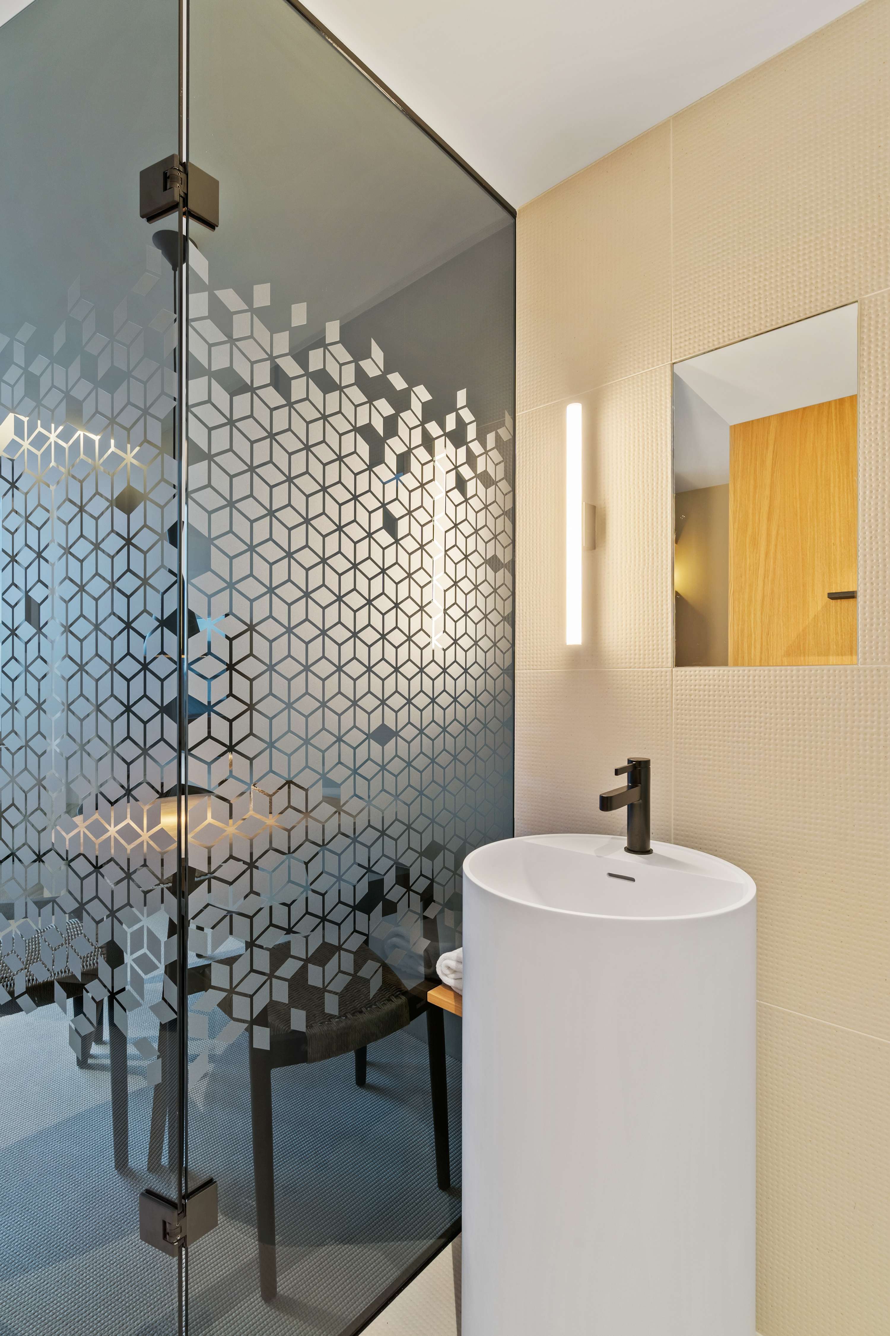 Elegant Vanity Area – Modern sink design paired with warm wooden accents for a sophisticated touch.