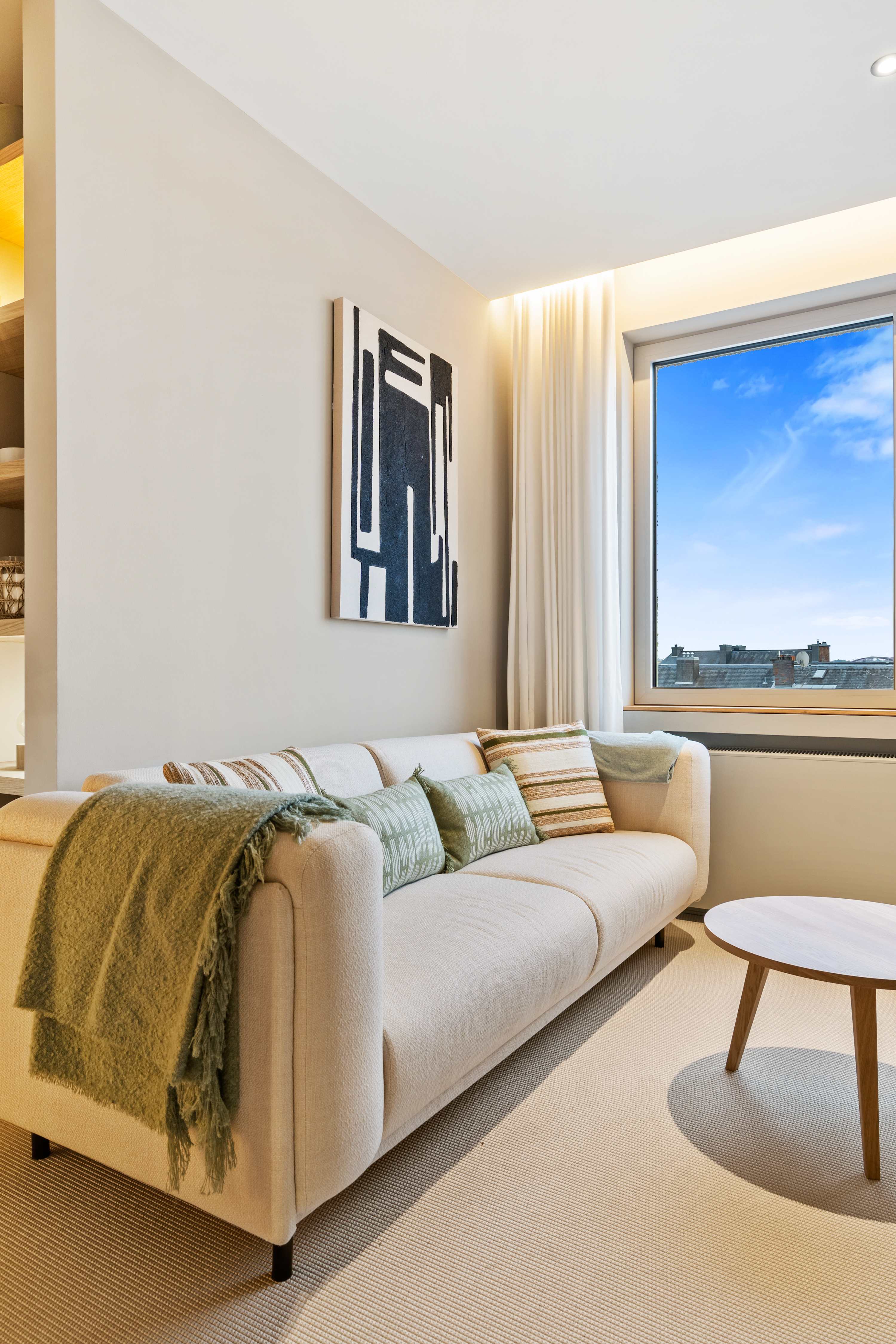 Cozy Comfort Awaits – Sink into this plush sofa, perfect for relaxing after a day of exploring.