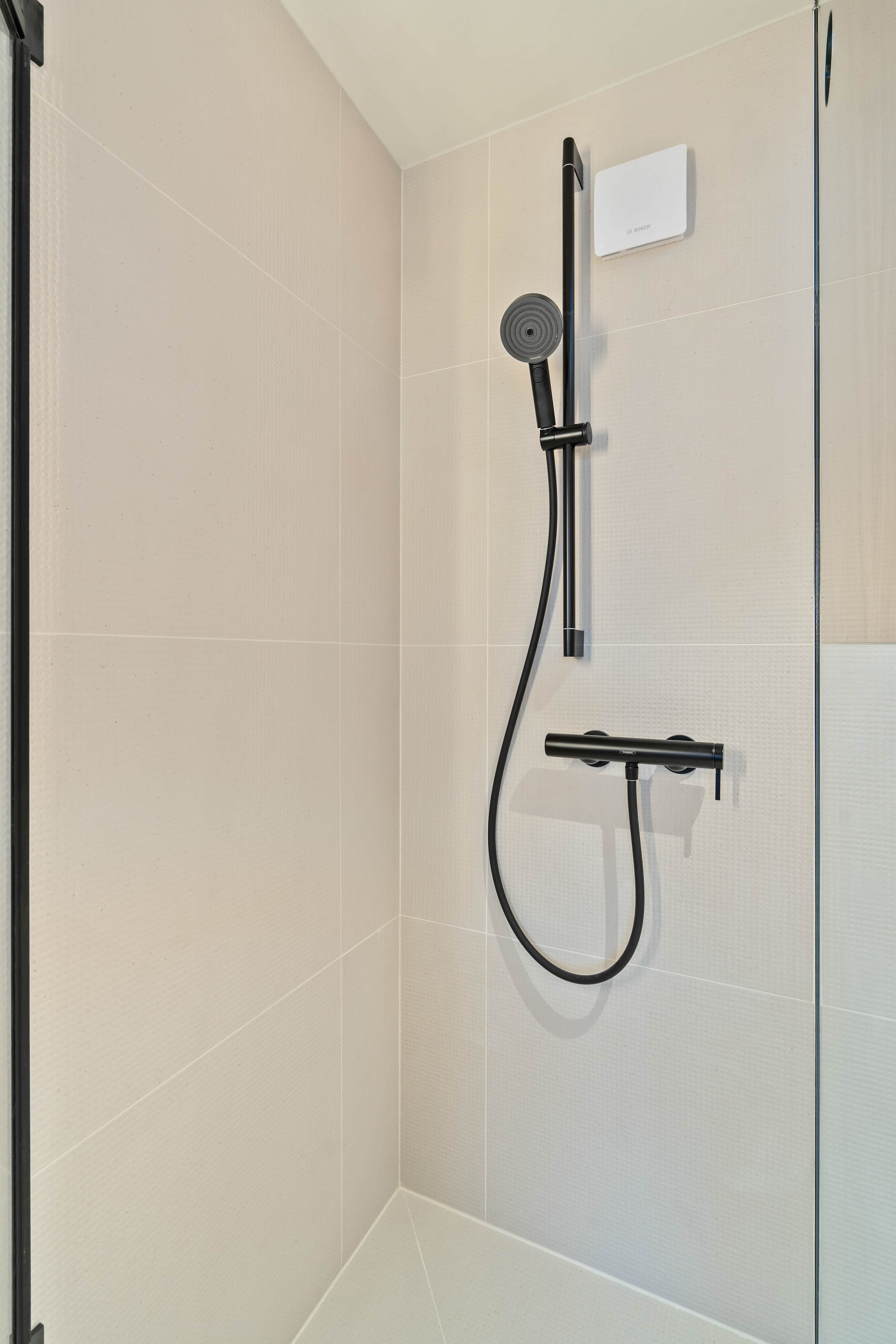 Luxurious Walk-In Shower – Refresh in the spacious and well-lit bathroom with premium fixtures.