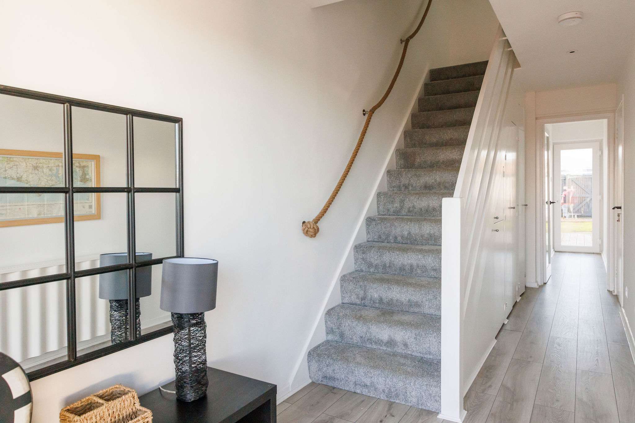 Bright, modern entrance with nautical charm