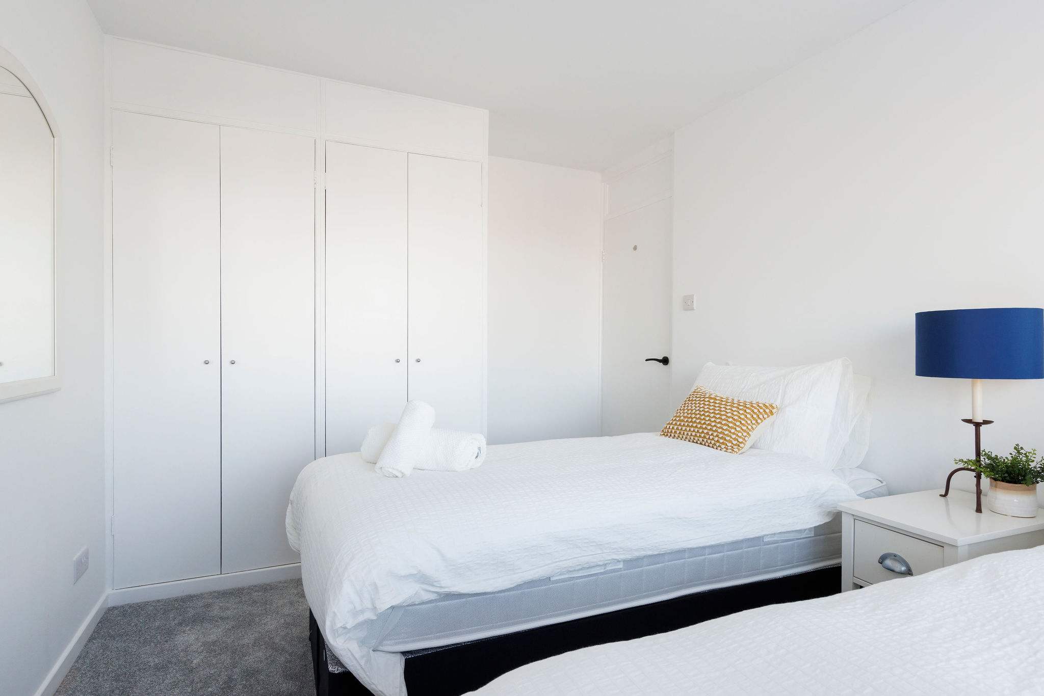 Bright twin room with plenty of storage