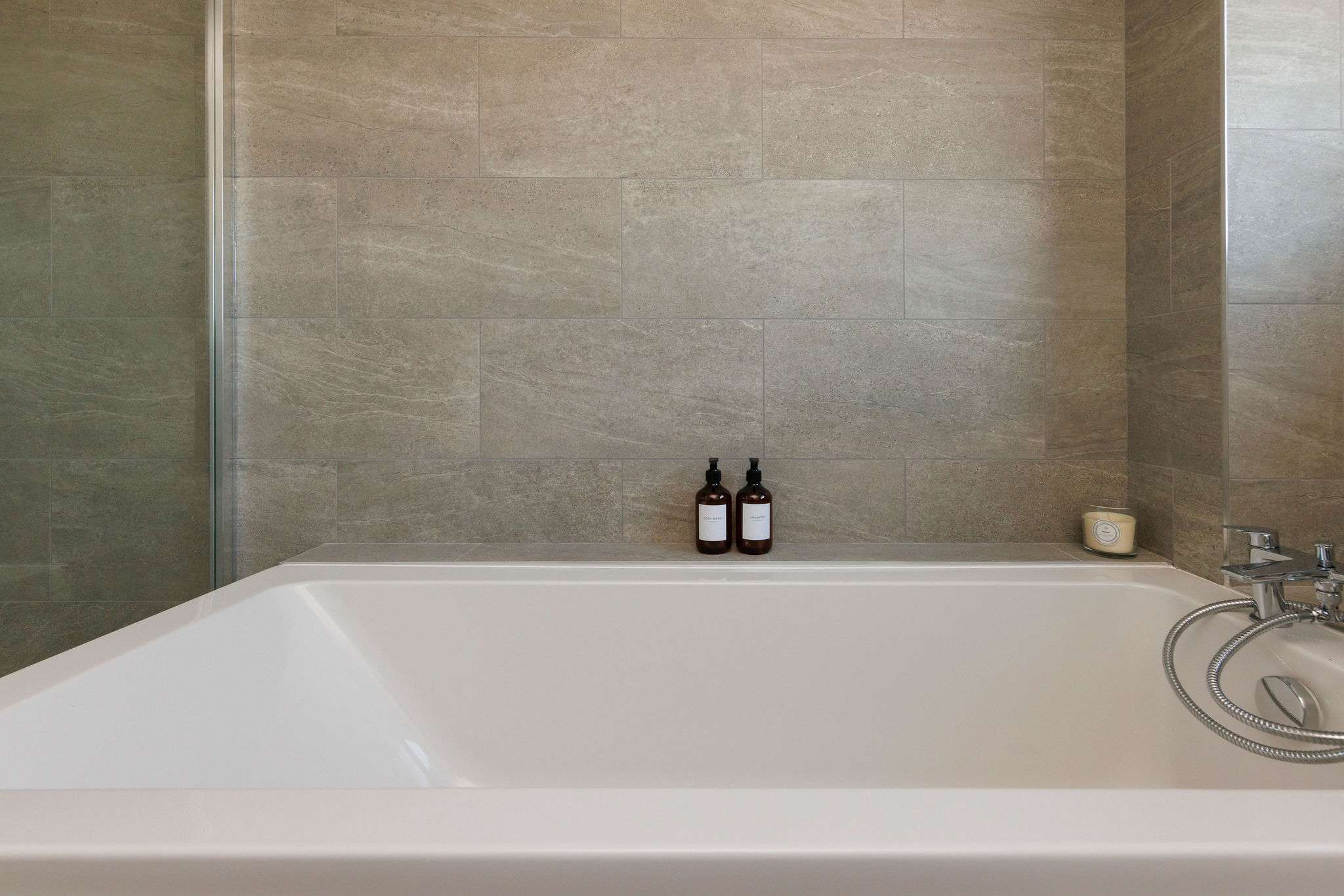 Relax in a luxurious bathtub after a day by the sea