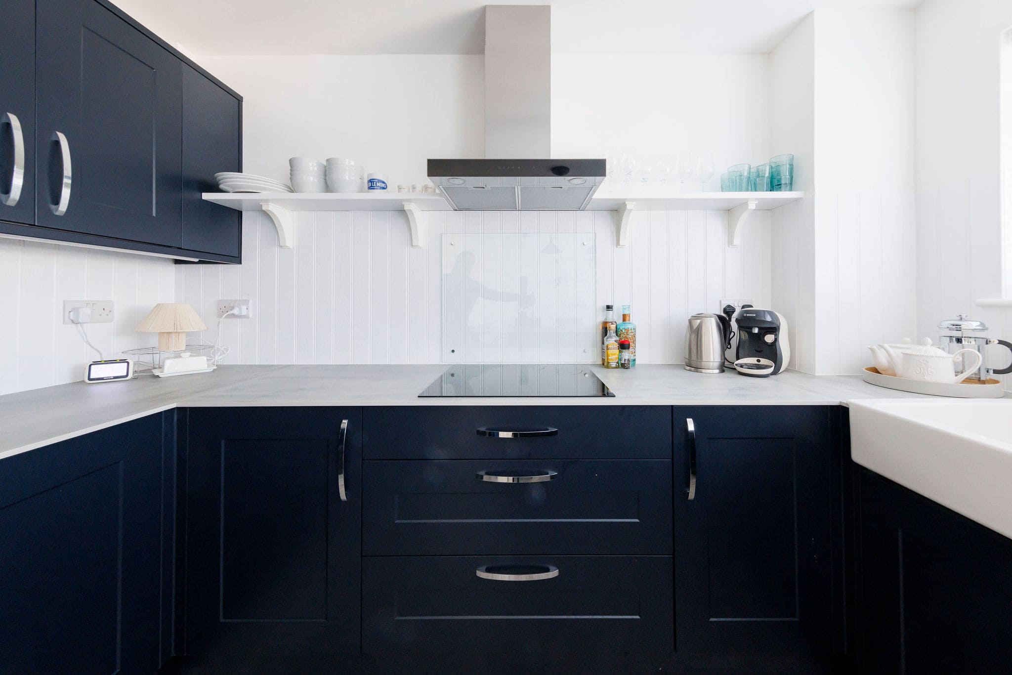 Fully equipped kitchen with induction cooktop and essentials