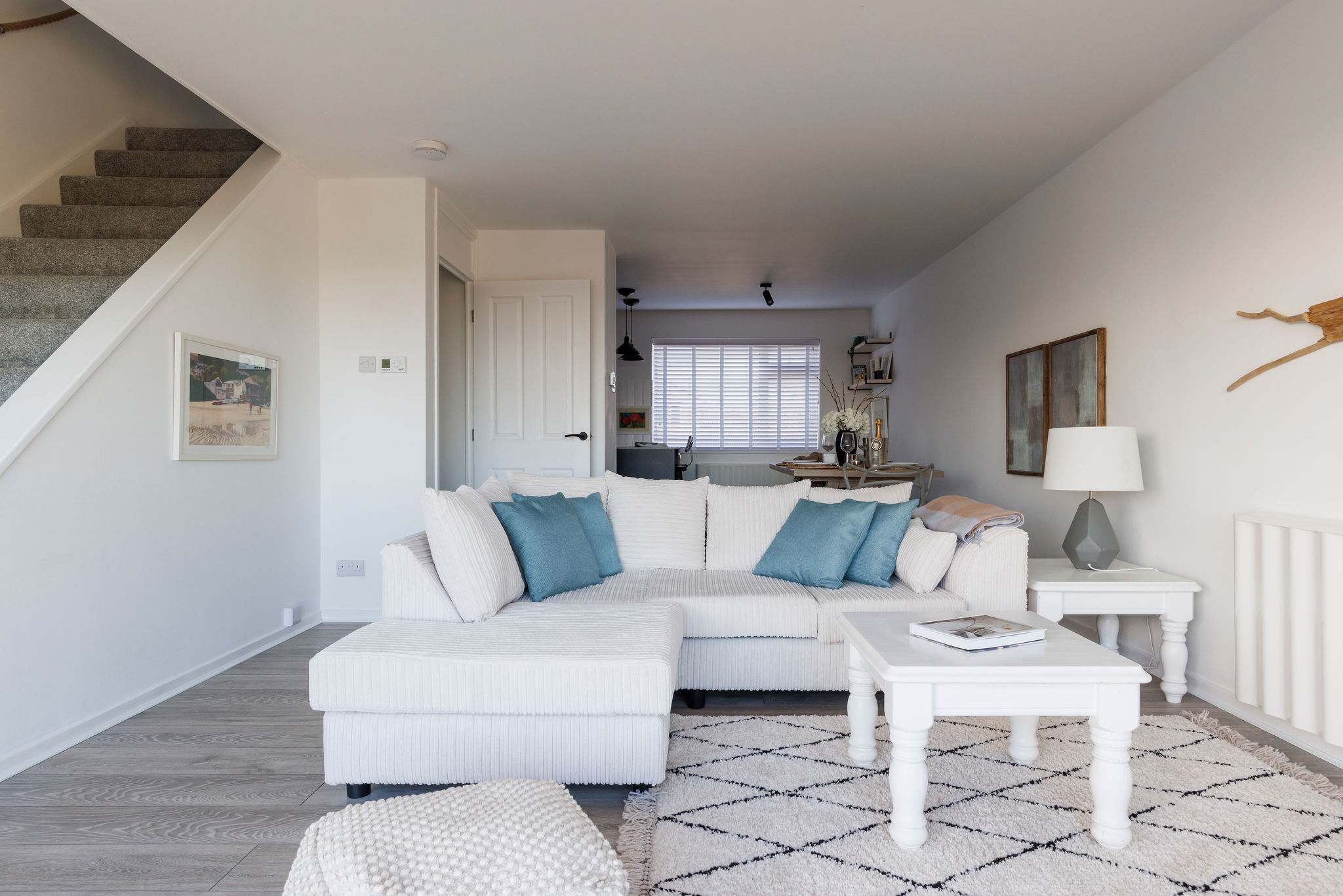 Cozy living space with soft furnishings and natural light