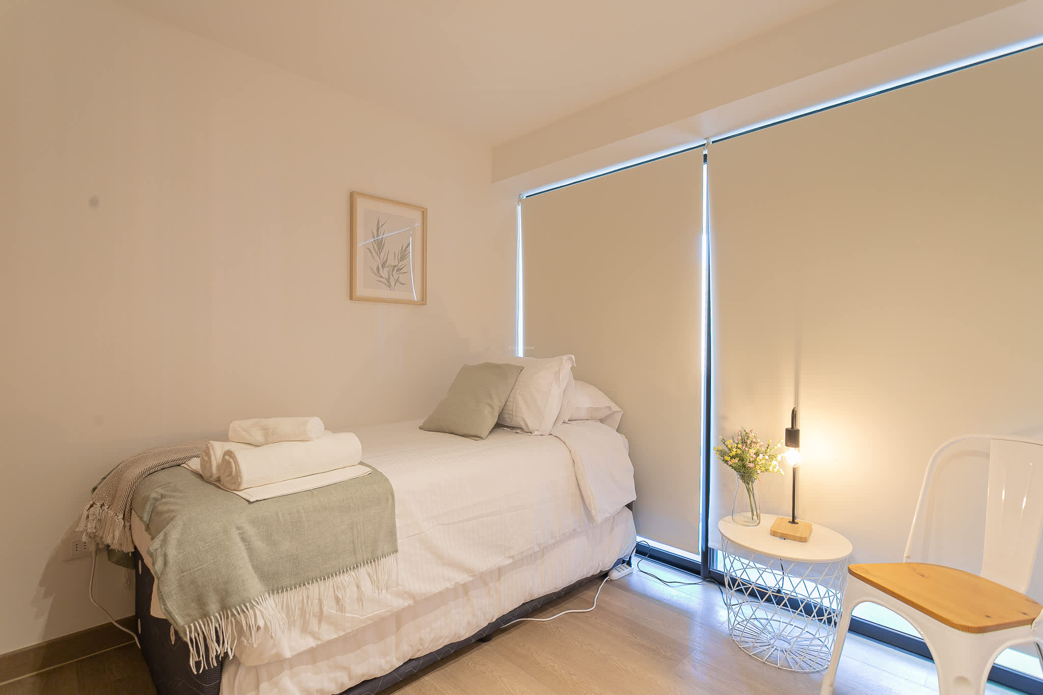 Cozy bedroom retreat with soft lighting and serene decor, perfect for a restful night's sleep.