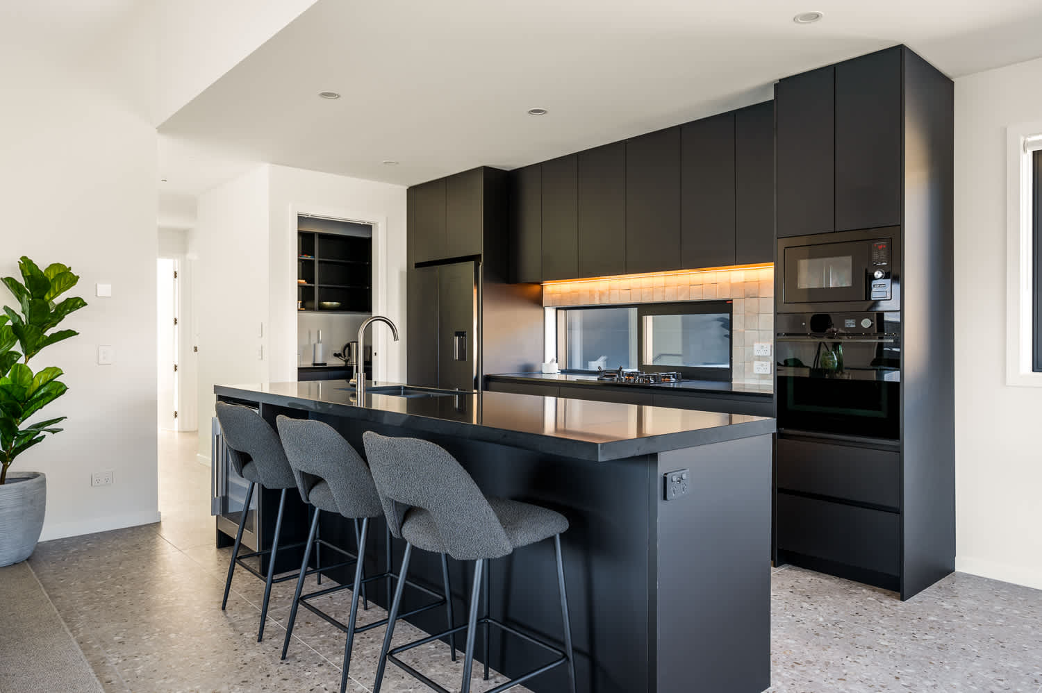 Designed with both home cooks and entertainers in mind, this kitchen offers ample countertop space, modern appliances, and abundant storage, making meal preparation a breeze.
