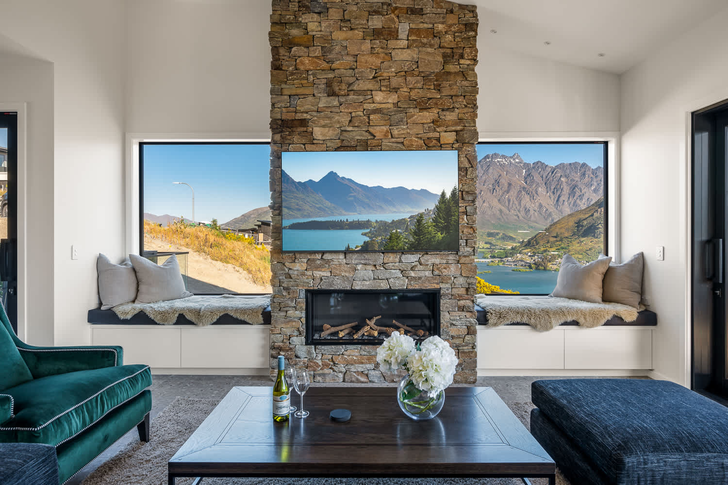 In the center is a cozy fireplace, perfect for warming up after a day of exploring the surrounding alpine wonderland