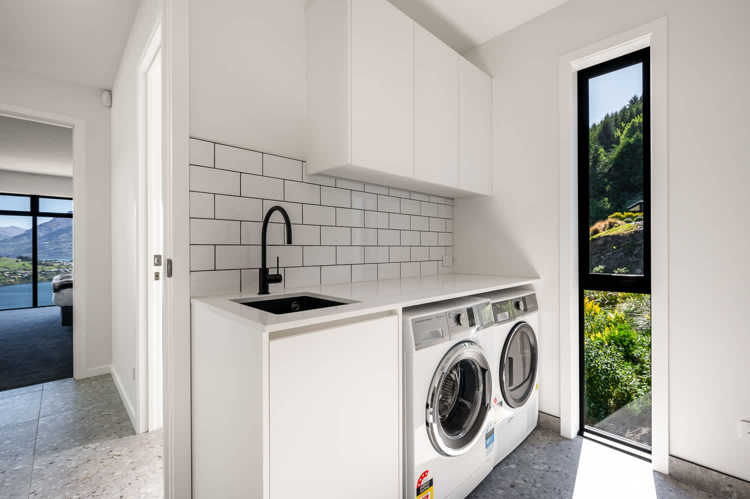 Enjoy the convenience of a well-equipped laundry area, designed for efficiency and practicality, perfect for managing all your cleaning needs after outdoor adventures.