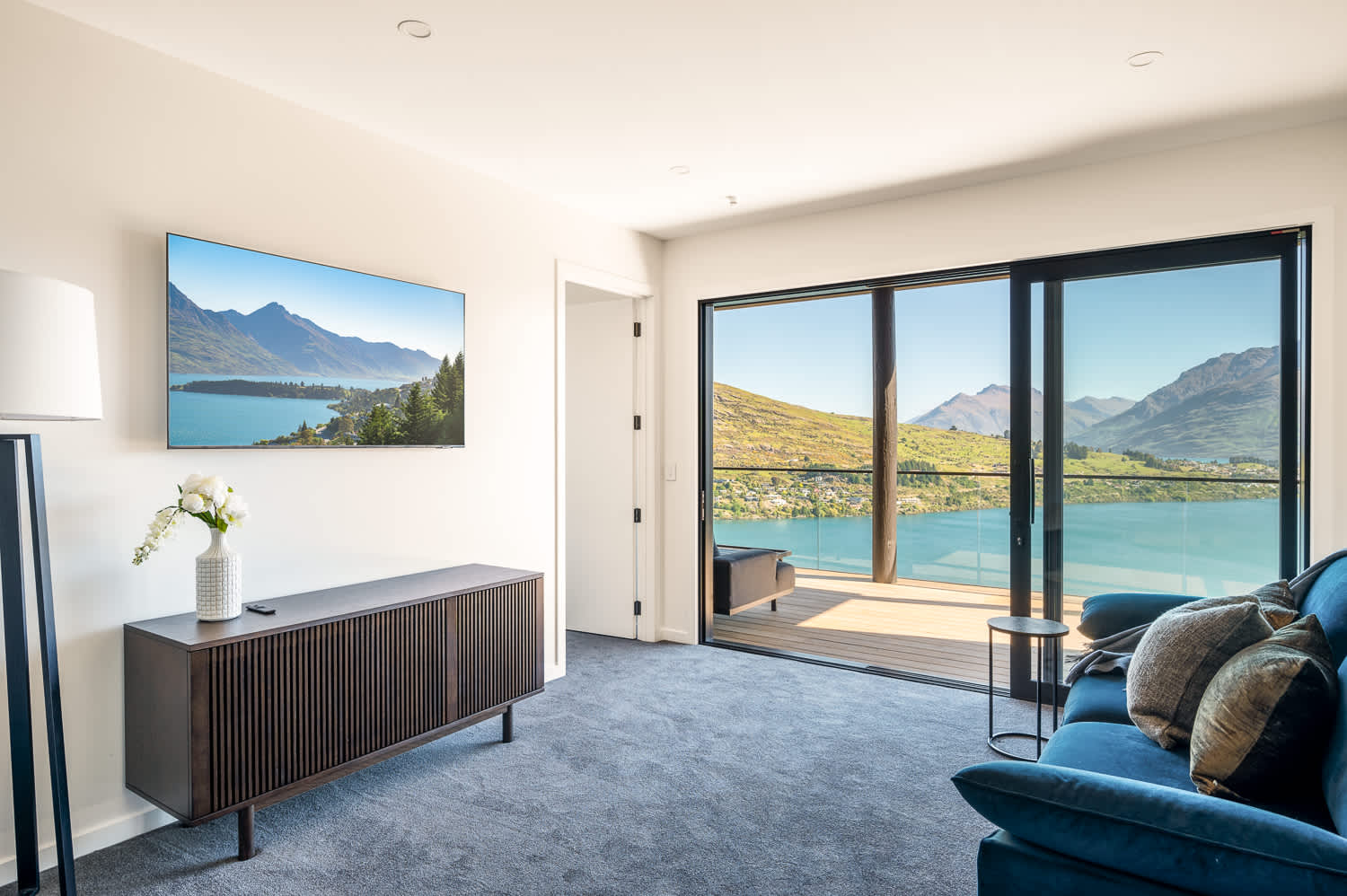 Adjacent to the bedroom is a spacious living room, ideal for unwinding or entertaining. 