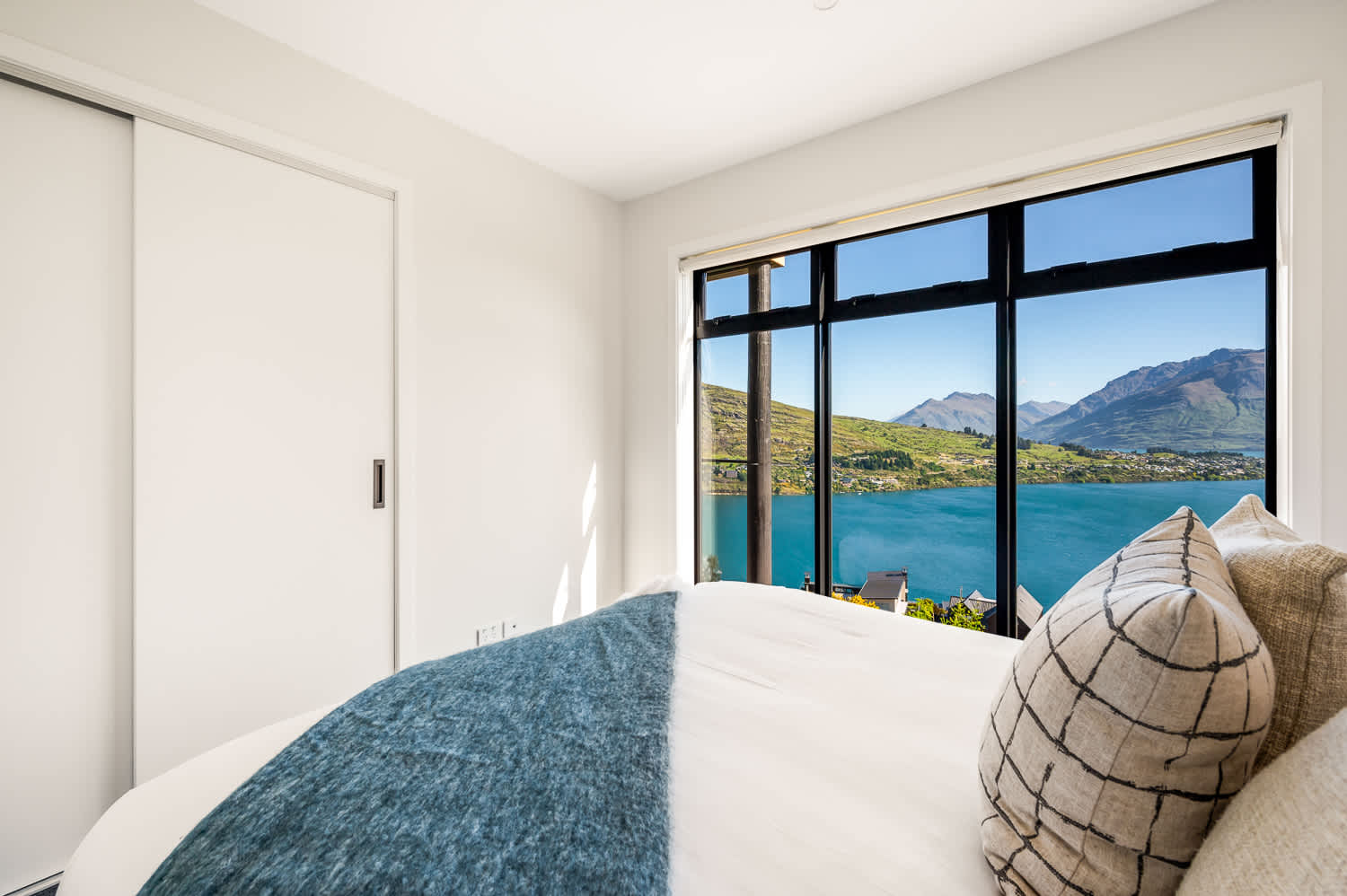 This bedroom creates a peaceful and luxurious atmosphere perfect for unwinding after a day of exploring Queenstown.