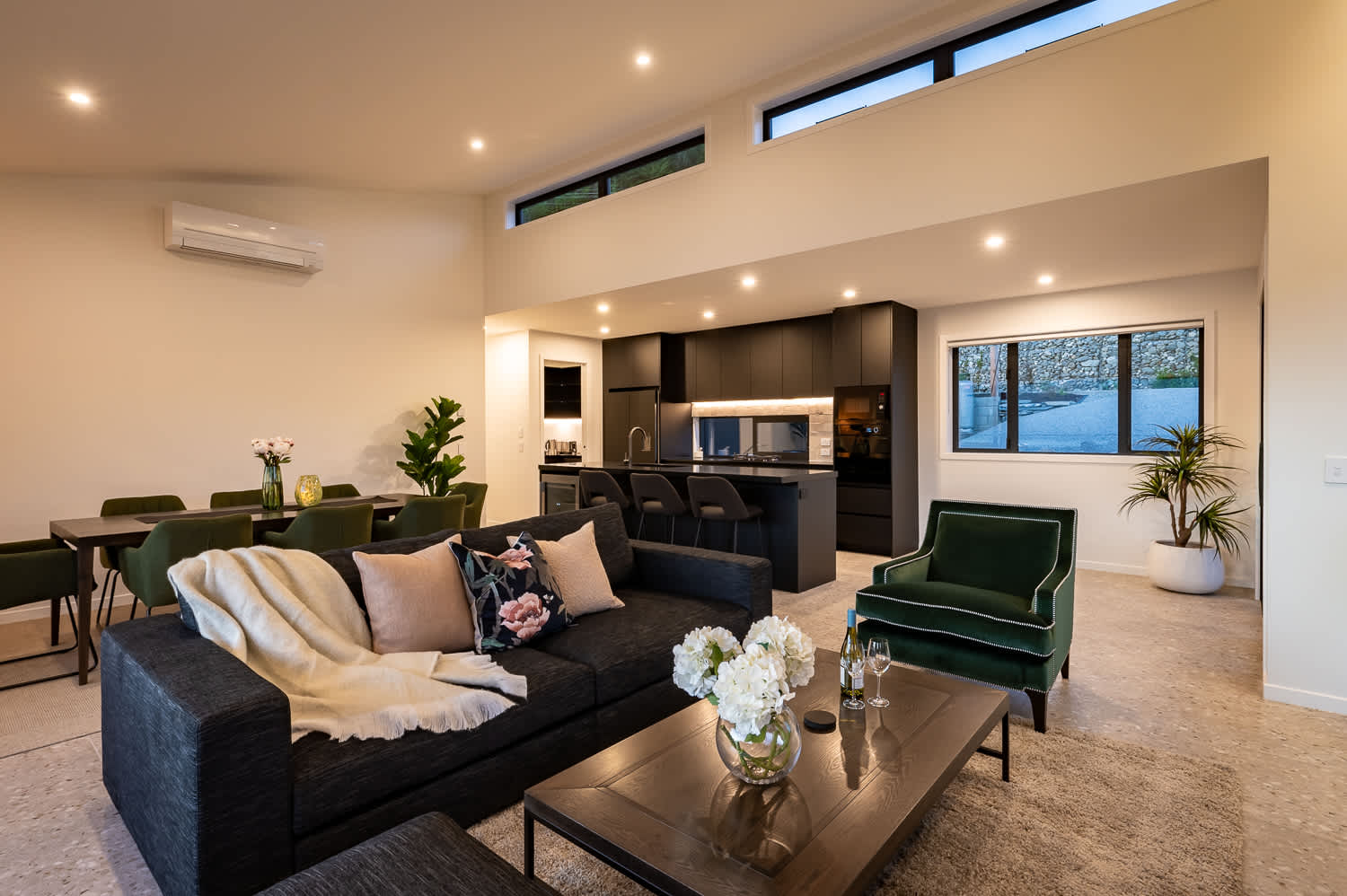 This inviting space offers plenty of room to relax and unwind, with a warm ambiance perfect for those chilly evenings.