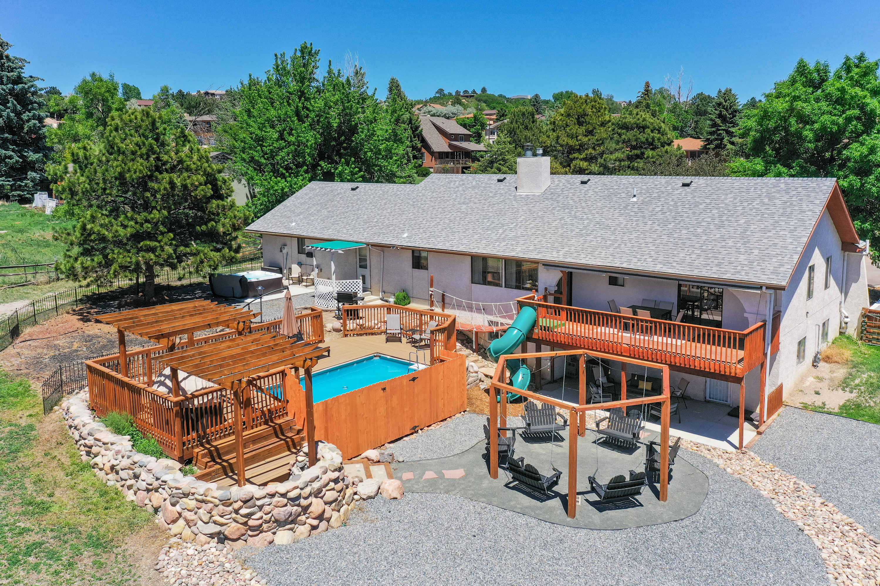 Evergreen Luxe! Backyard Oasis w/ Pool & Hot Tub! — Colorado Springs, CO — vacation rental