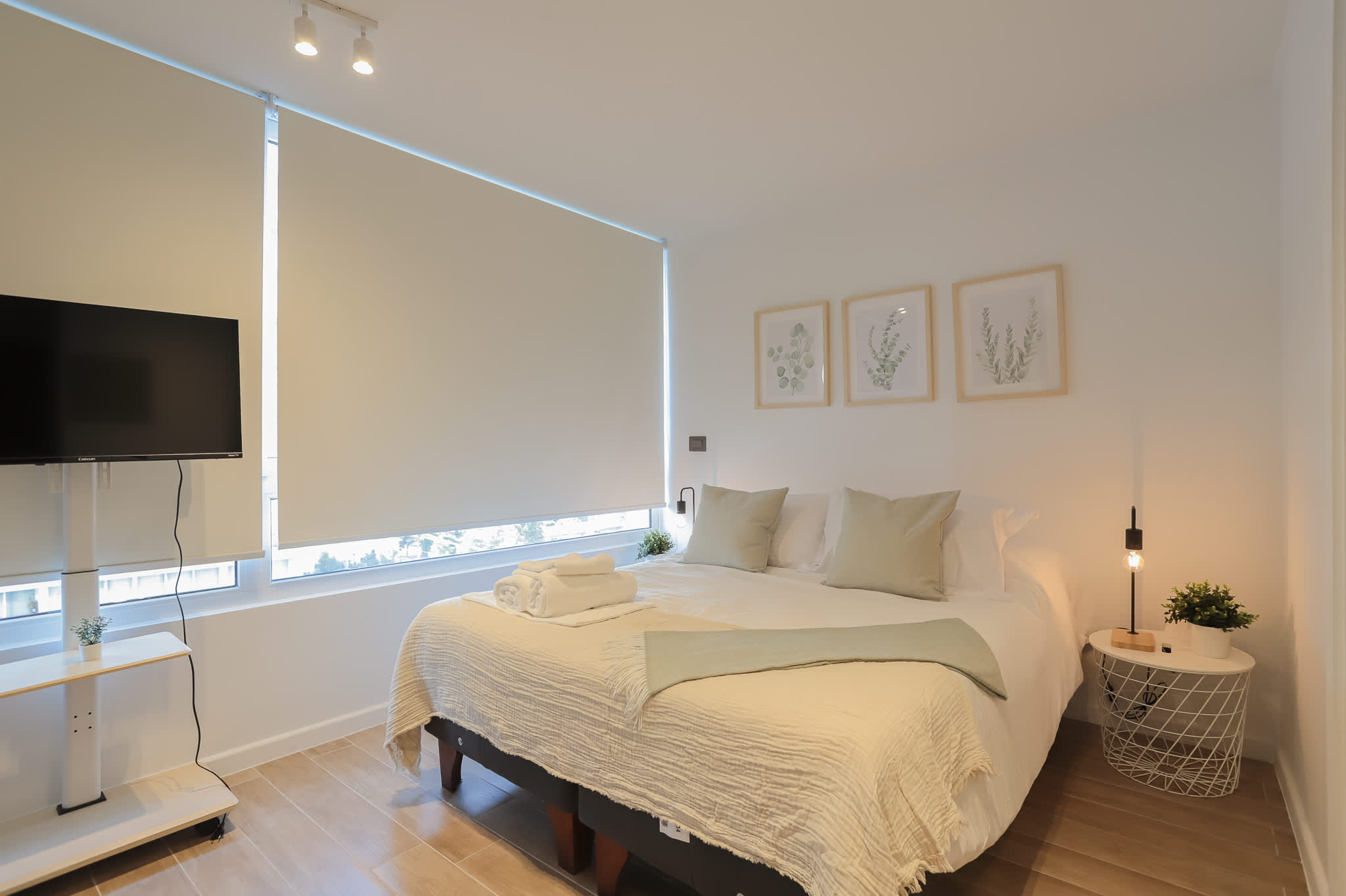 Relax in this cozy studio with a comfortable bed, modern decor, and a convenient wall-mounted TV, perfect for unwinding after exploring the city.