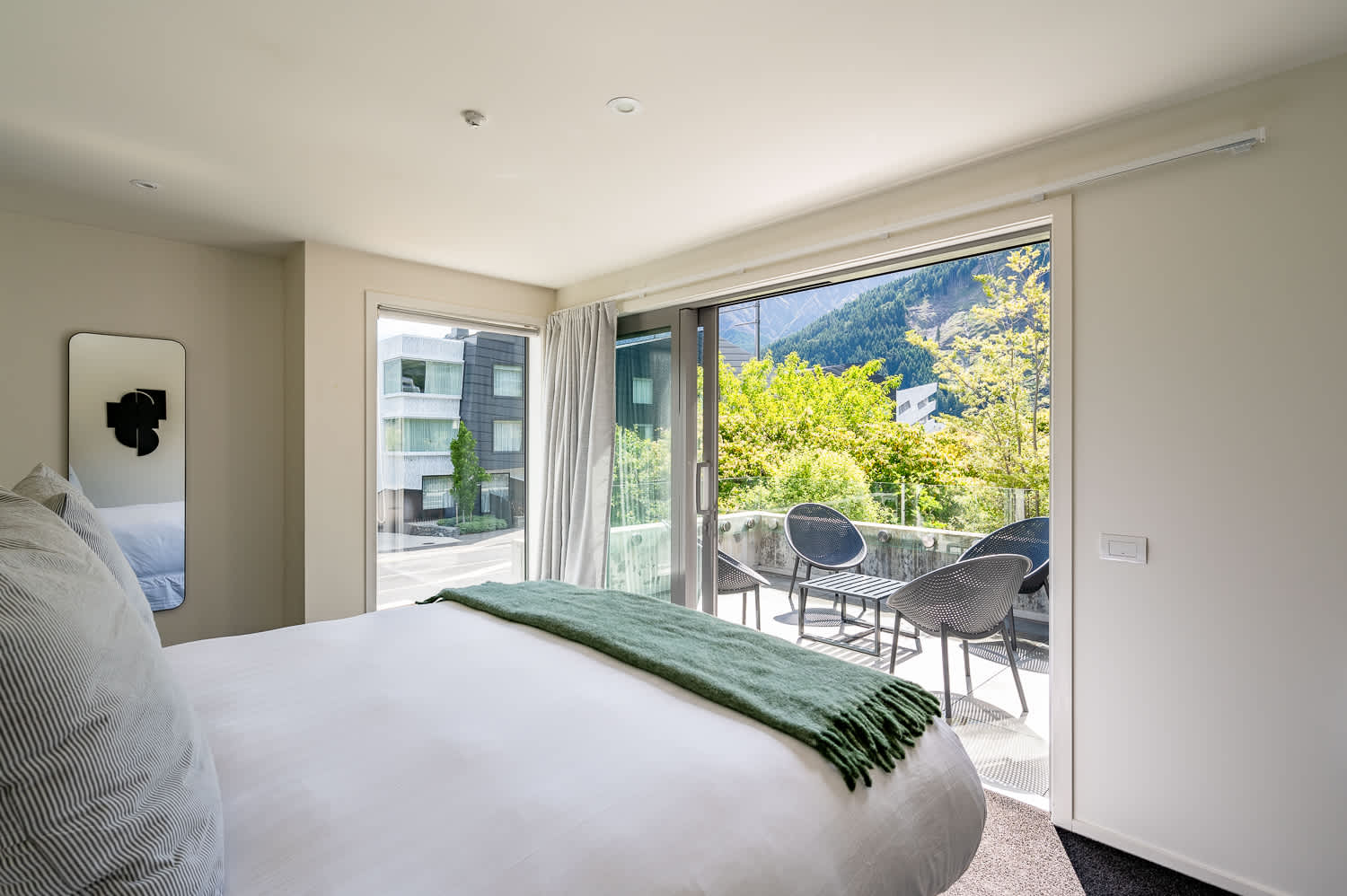 Simply stylish Master Bedroom with Outdoor Access
Step out onto this bright and sunny patio with beautiful morning sun for a fresh start to your Queenstown stay.