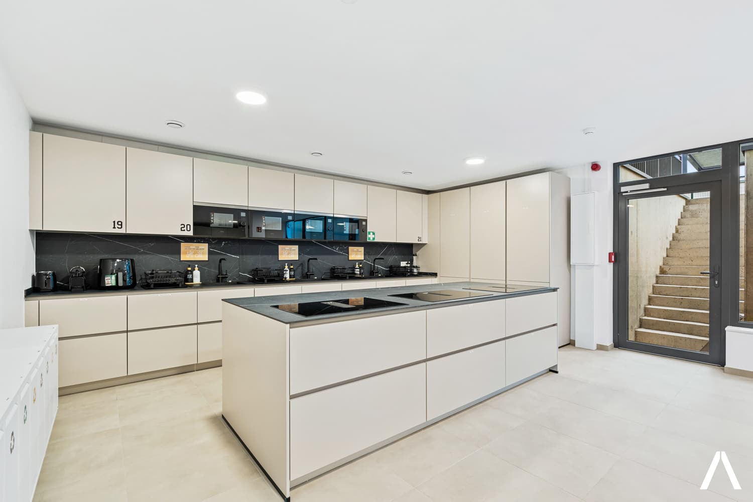 Abundant Storage and Counter Space – Organized and functional shared kitchen with ample cabinetry and stylish finishes.