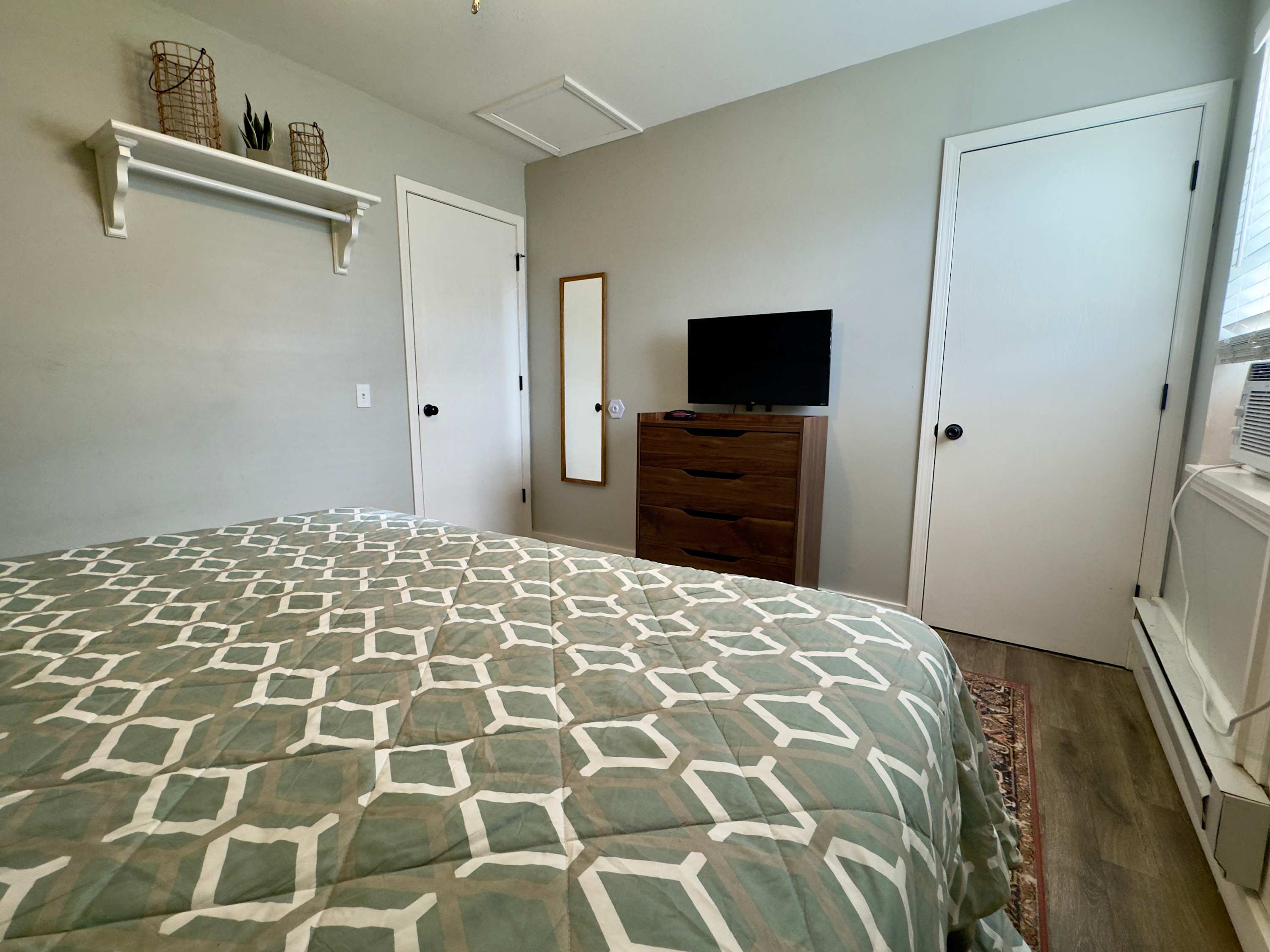 Bedroom angle view showing the Roku TV.