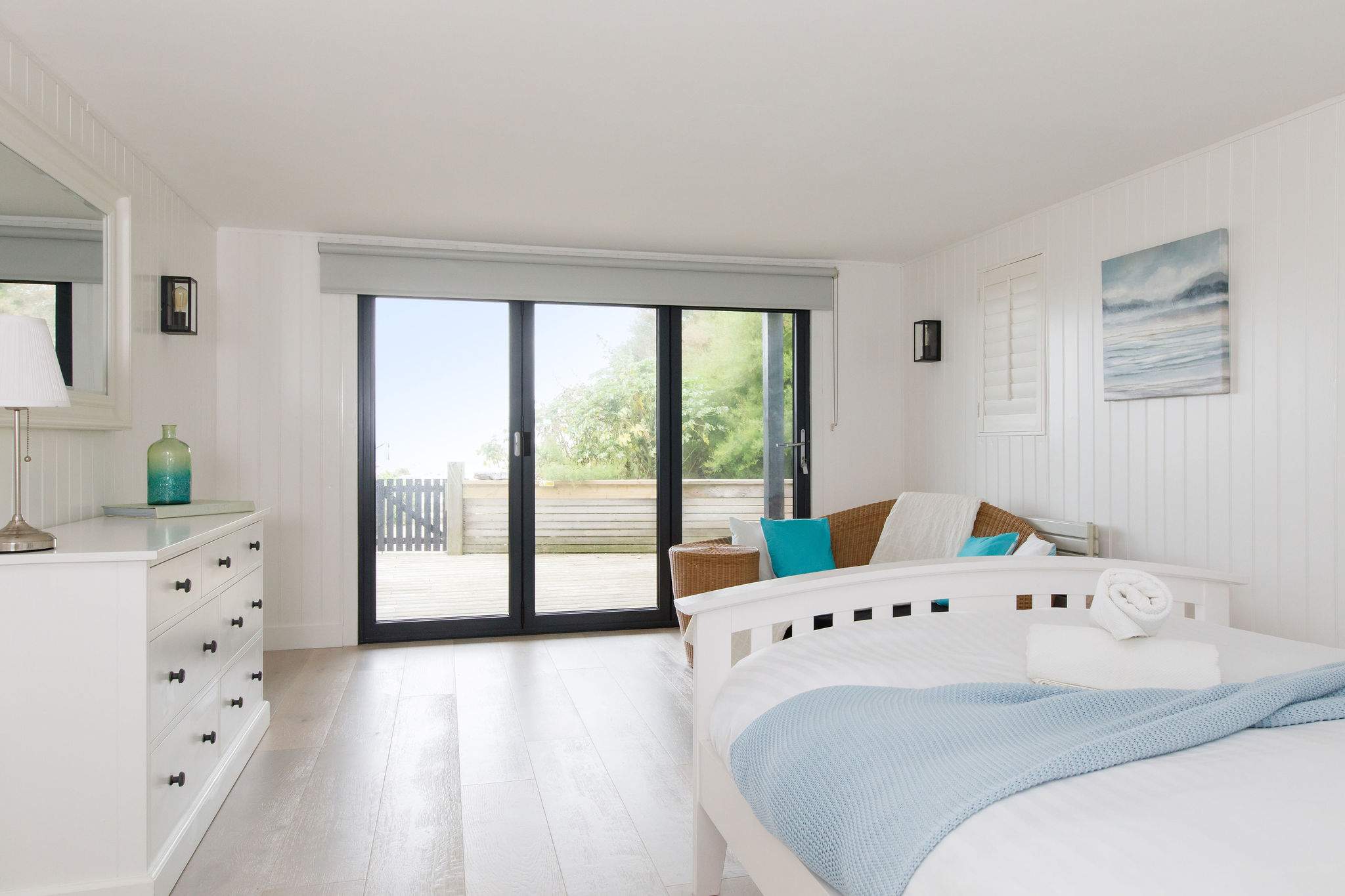 The king size bedroom with ensuite and dressing room is on the ground floor with direct access to the garden/beach.