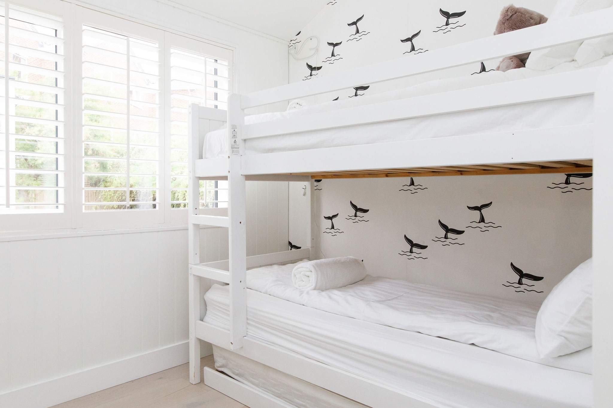 The bunkroom has a pull out trundle to sleep 3 children.