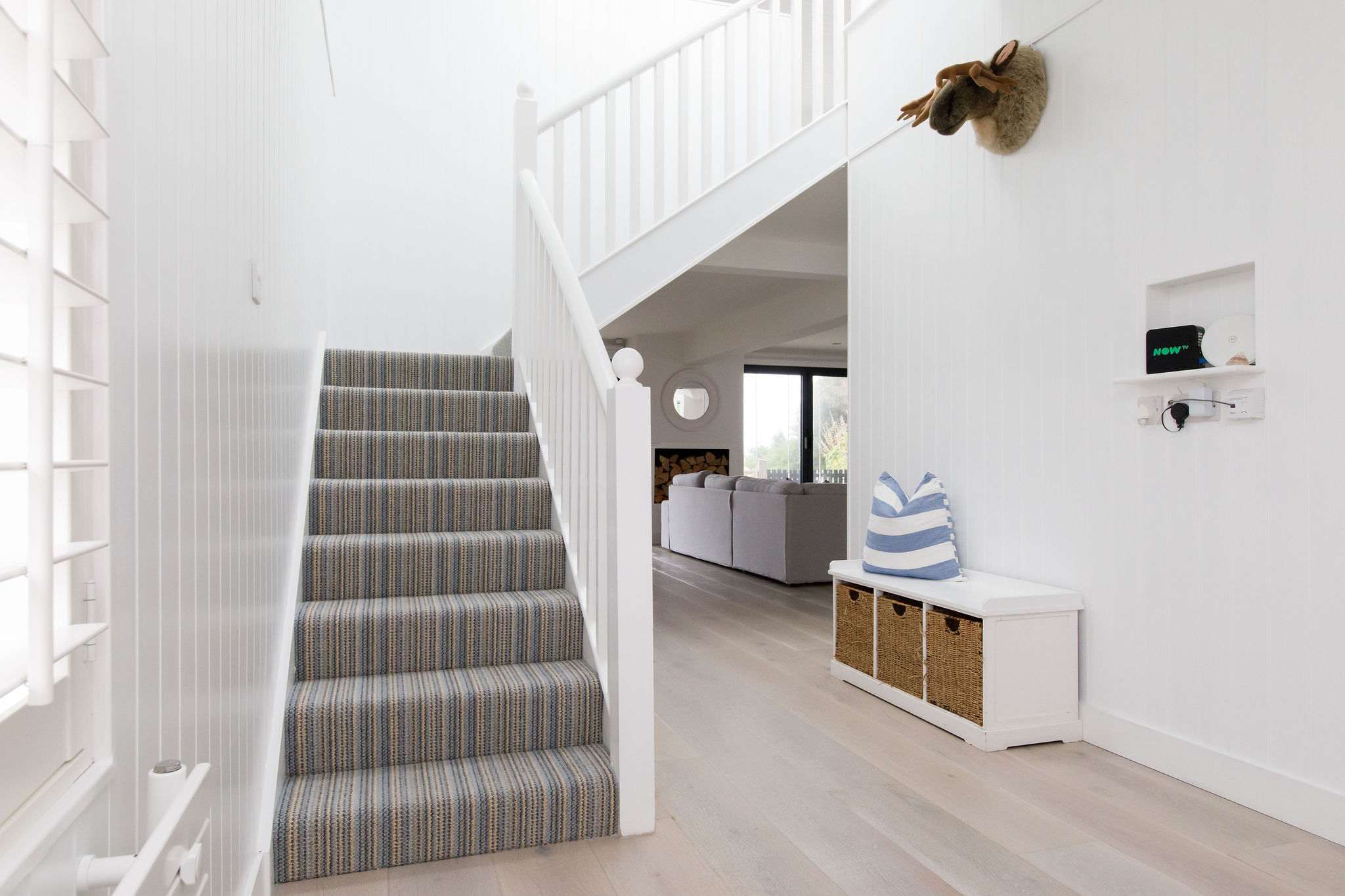 A bright and airy hallway you will find the stairs that leads up to the first floor.