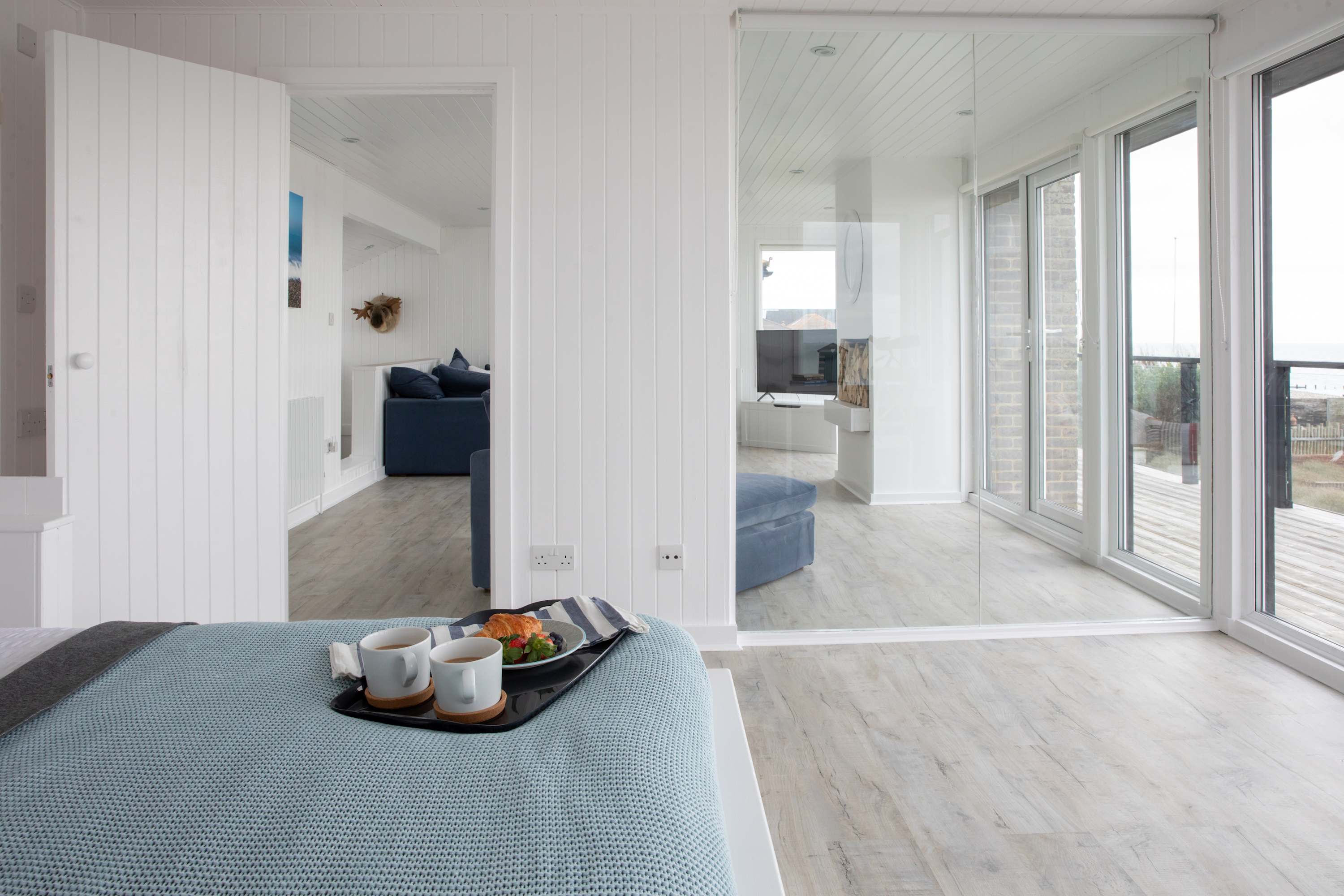 The first floor king is next to the upstairs lounge area and has direct balcony access.