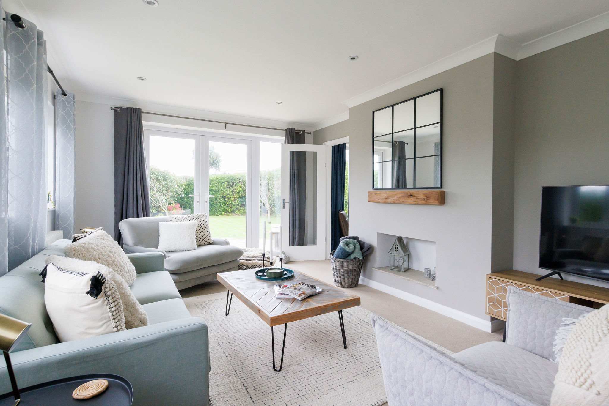 The stylish living room is the perfect place to relax and unwind. Decorated and furnished in soft, coastal tones.