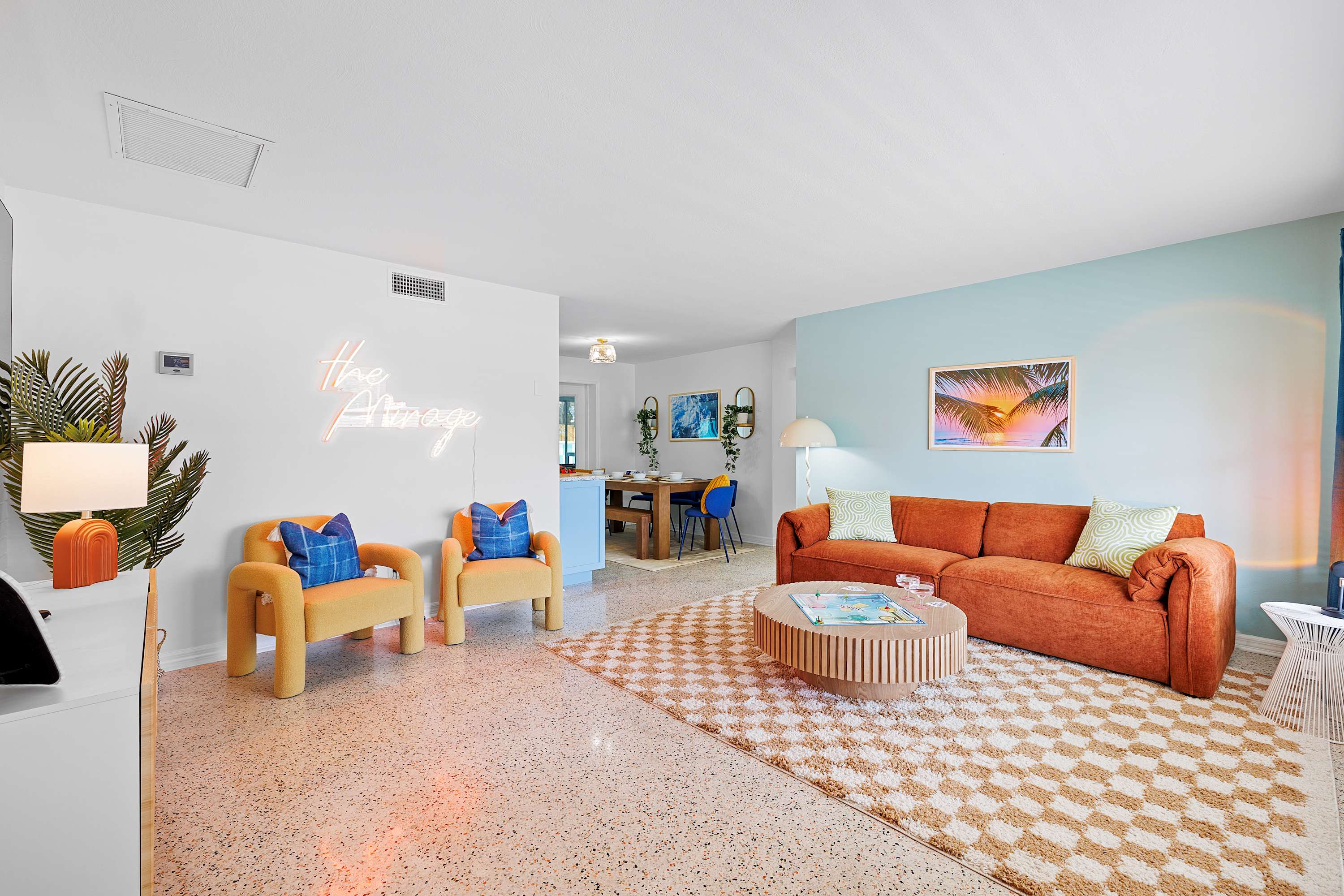 Bright living room w/ comfy seating and open flow for relaxing or gathering.