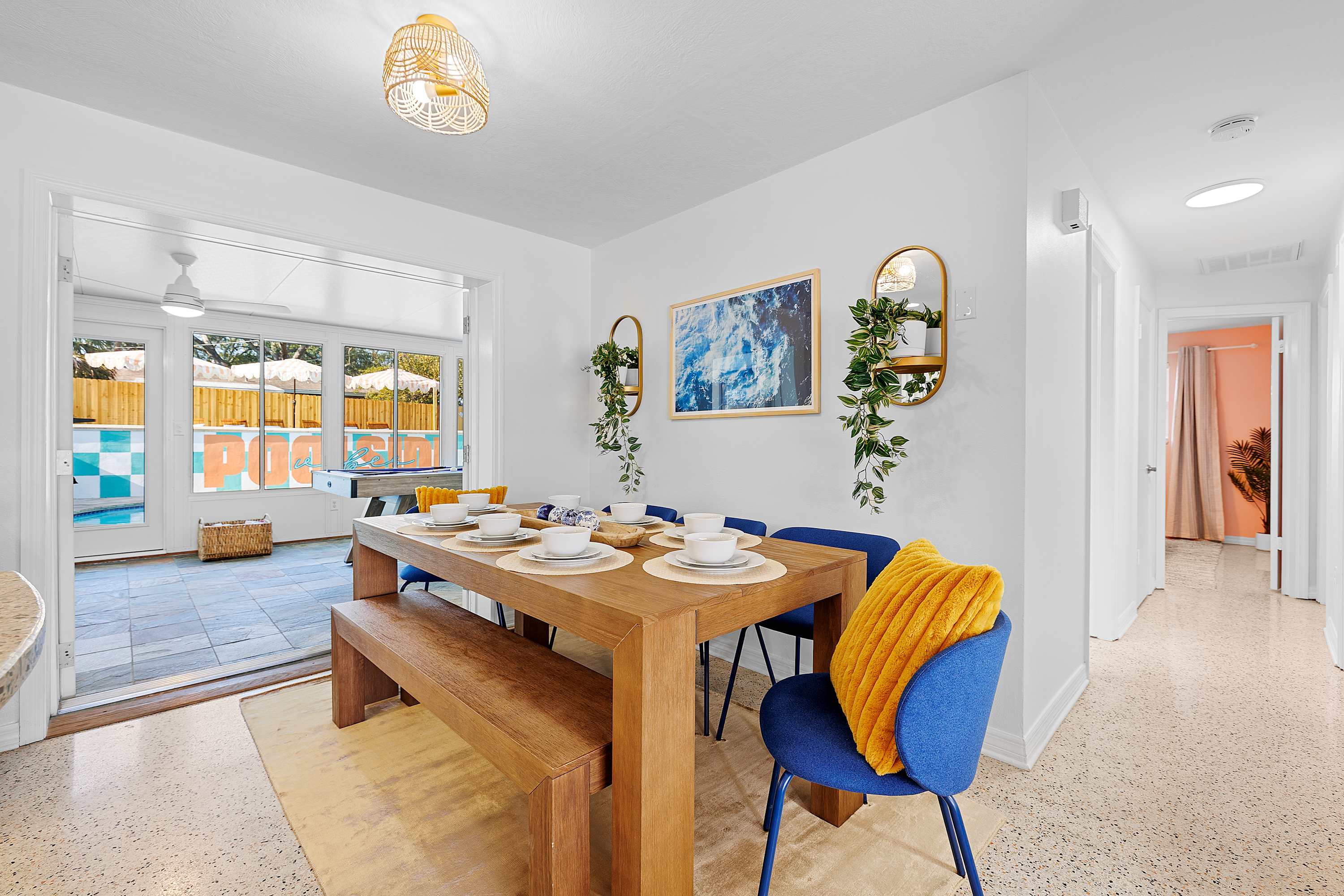 Dining space w/ wood table and cheerful seating for shared meals.