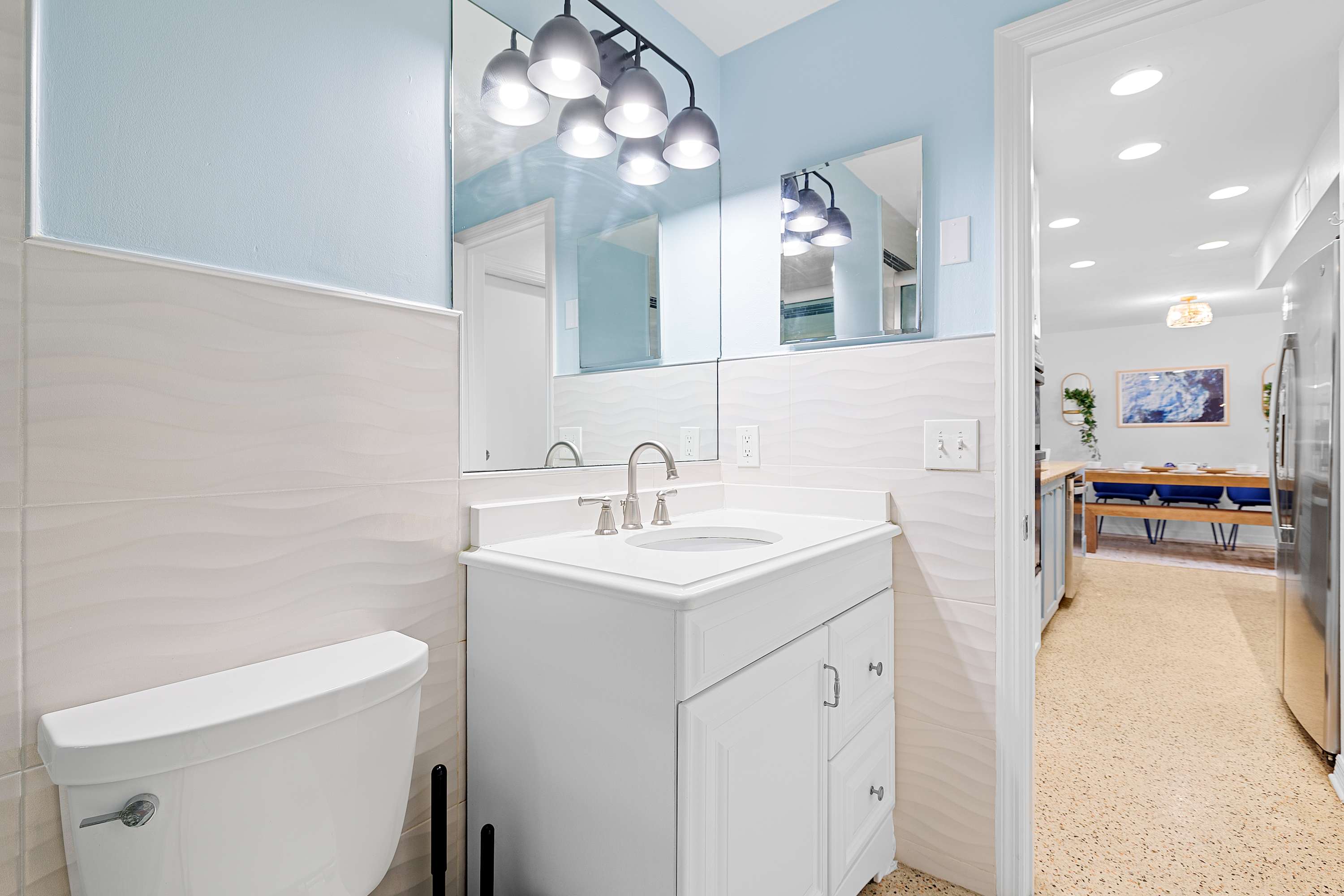Fresh bathroom w/ walk-in style shower and crisp white finishes.