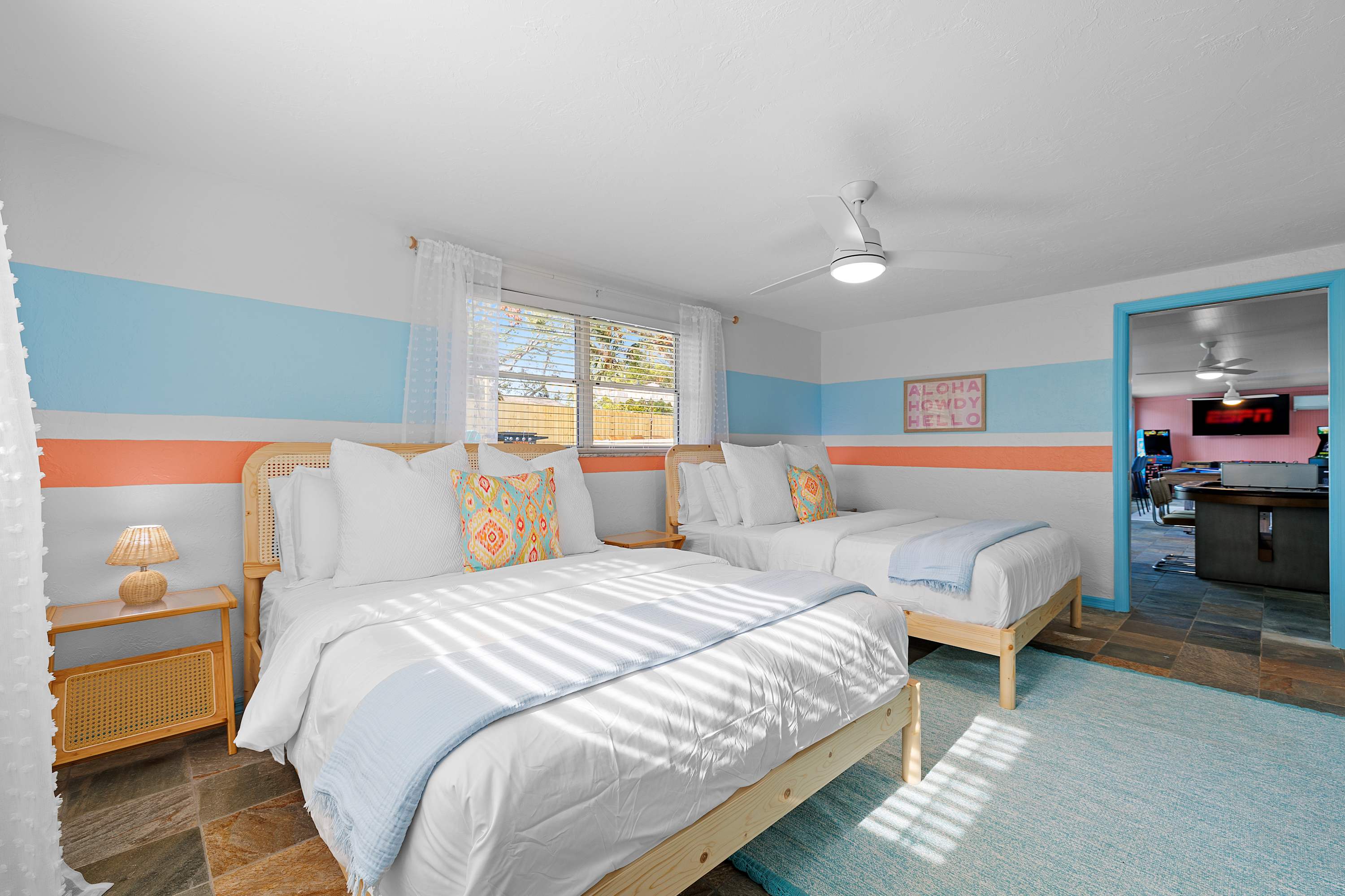 Bright bedroom w/ layered textures and a comfortable, homey feel.