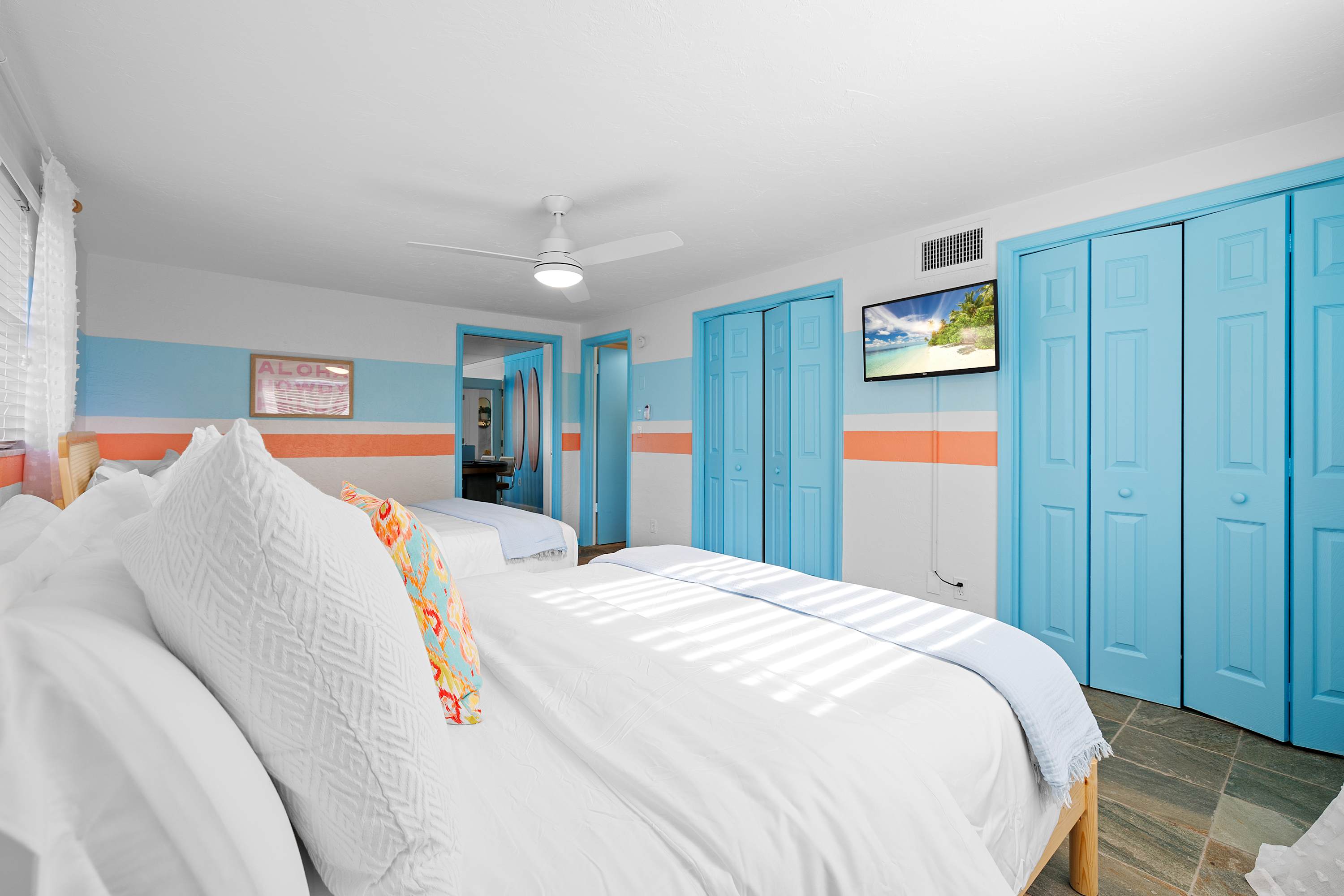 Calm bedroom w/ soft tones and a simple layout for easy relaxation.