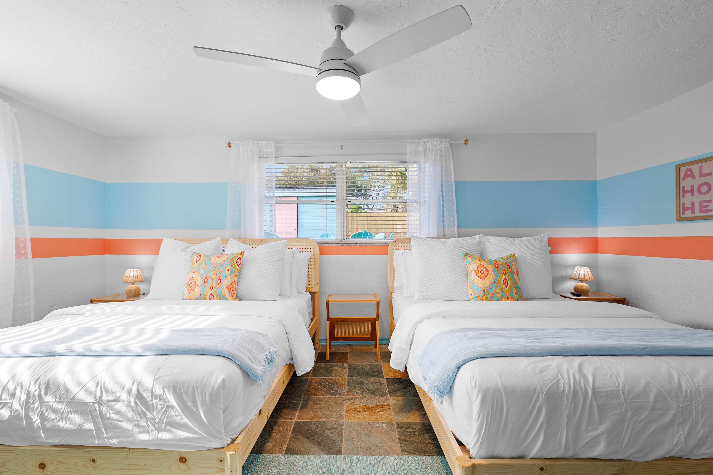 Colorful bedroom w/ playful accents and a light, upbeat mood.