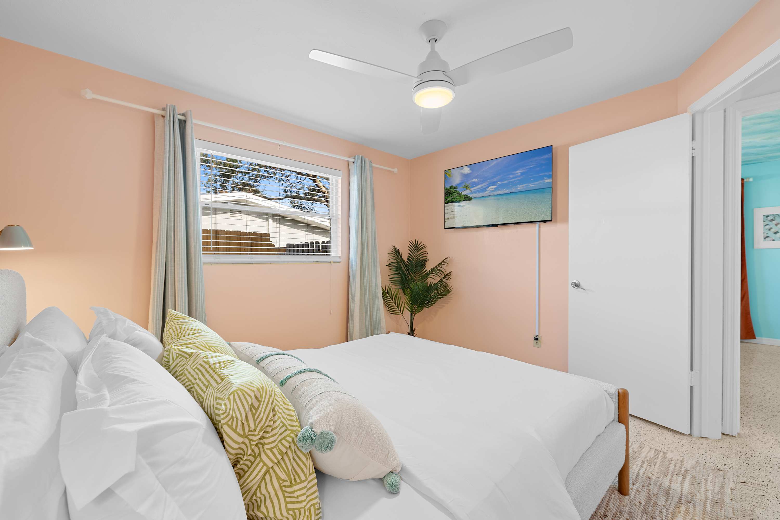 Colorful bedroom w/ playful accents and a light, upbeat mood.