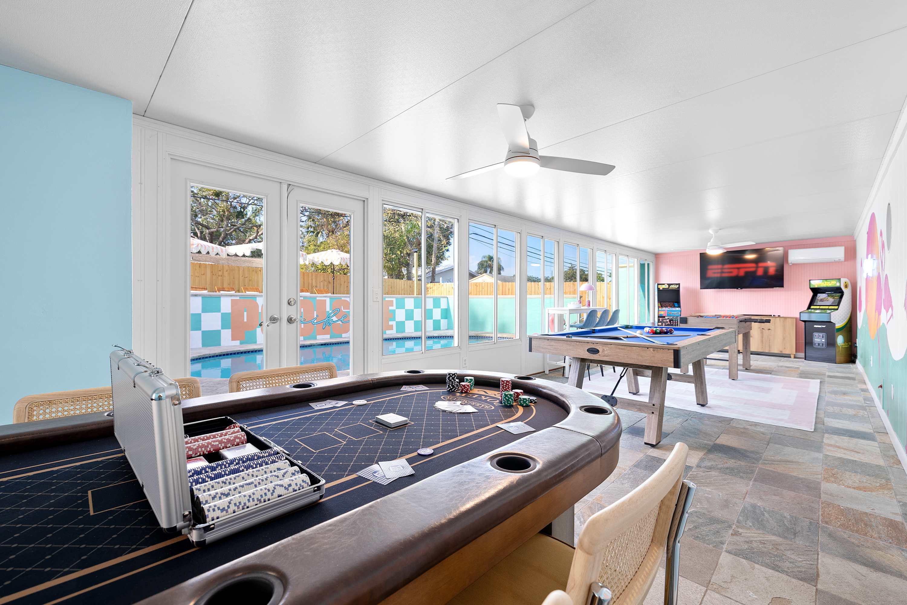 Bright game room w/ pool table, comfy seating, and big windows for all-day fun.
