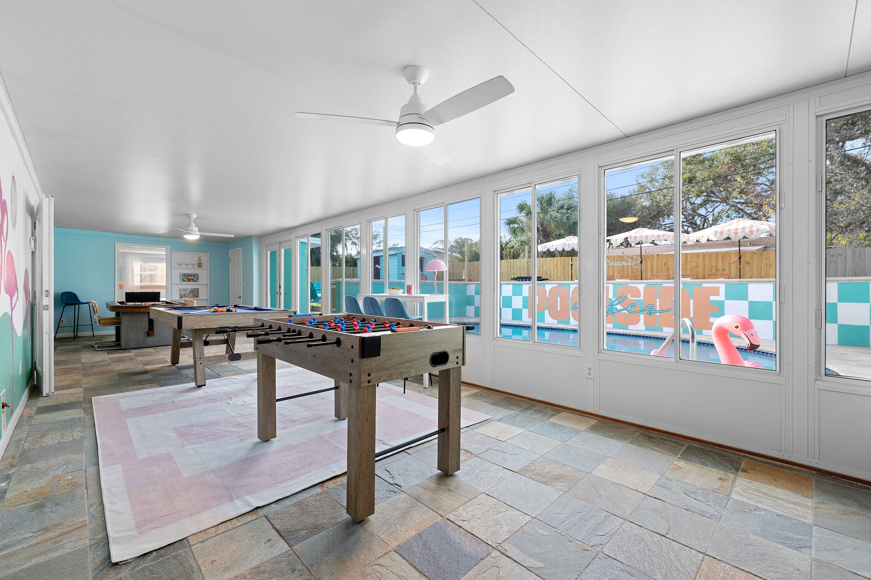 Bright game room w/ ping pong table and lots of natural light.