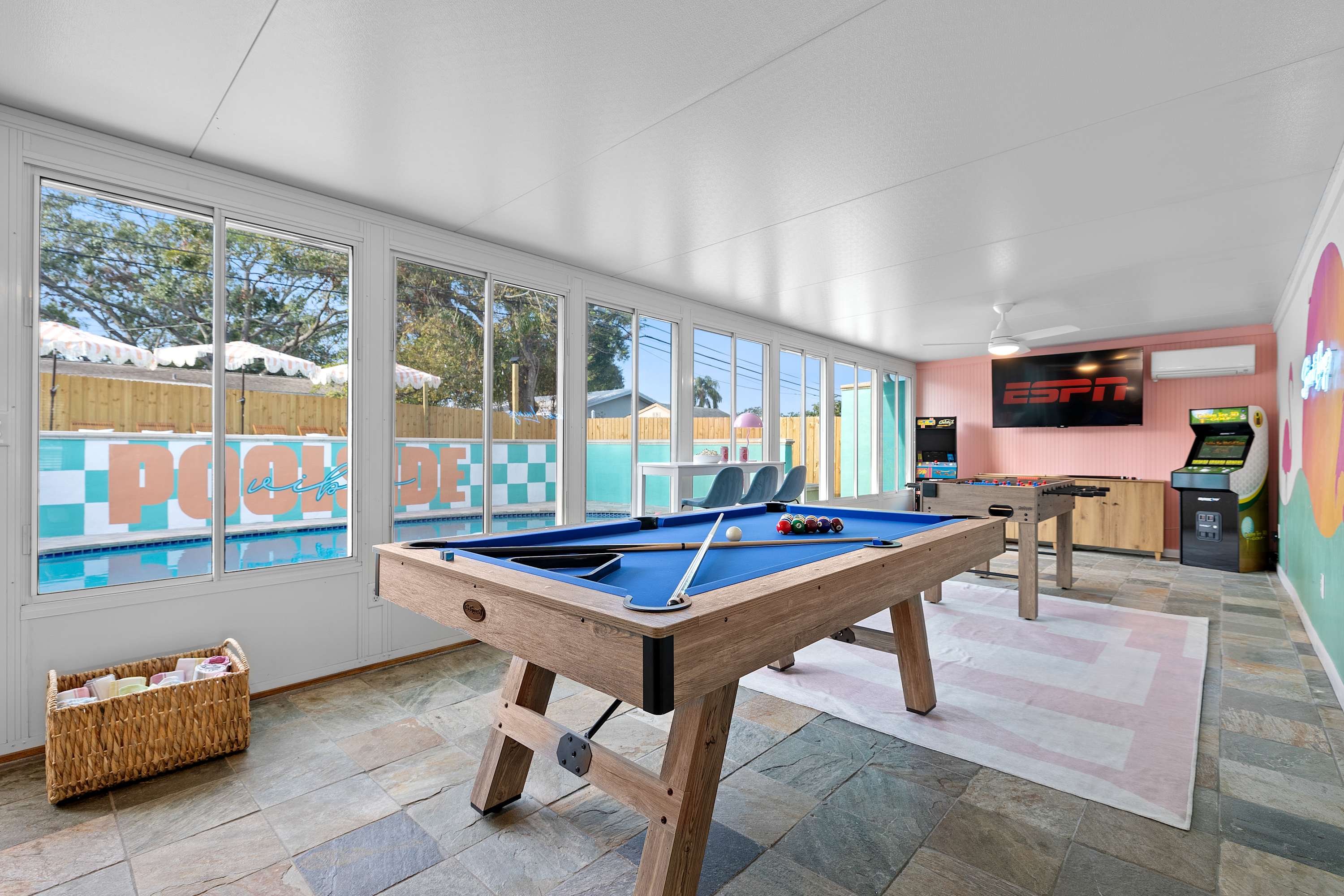 Pool table setup in an open, airy space made for friendly competition.