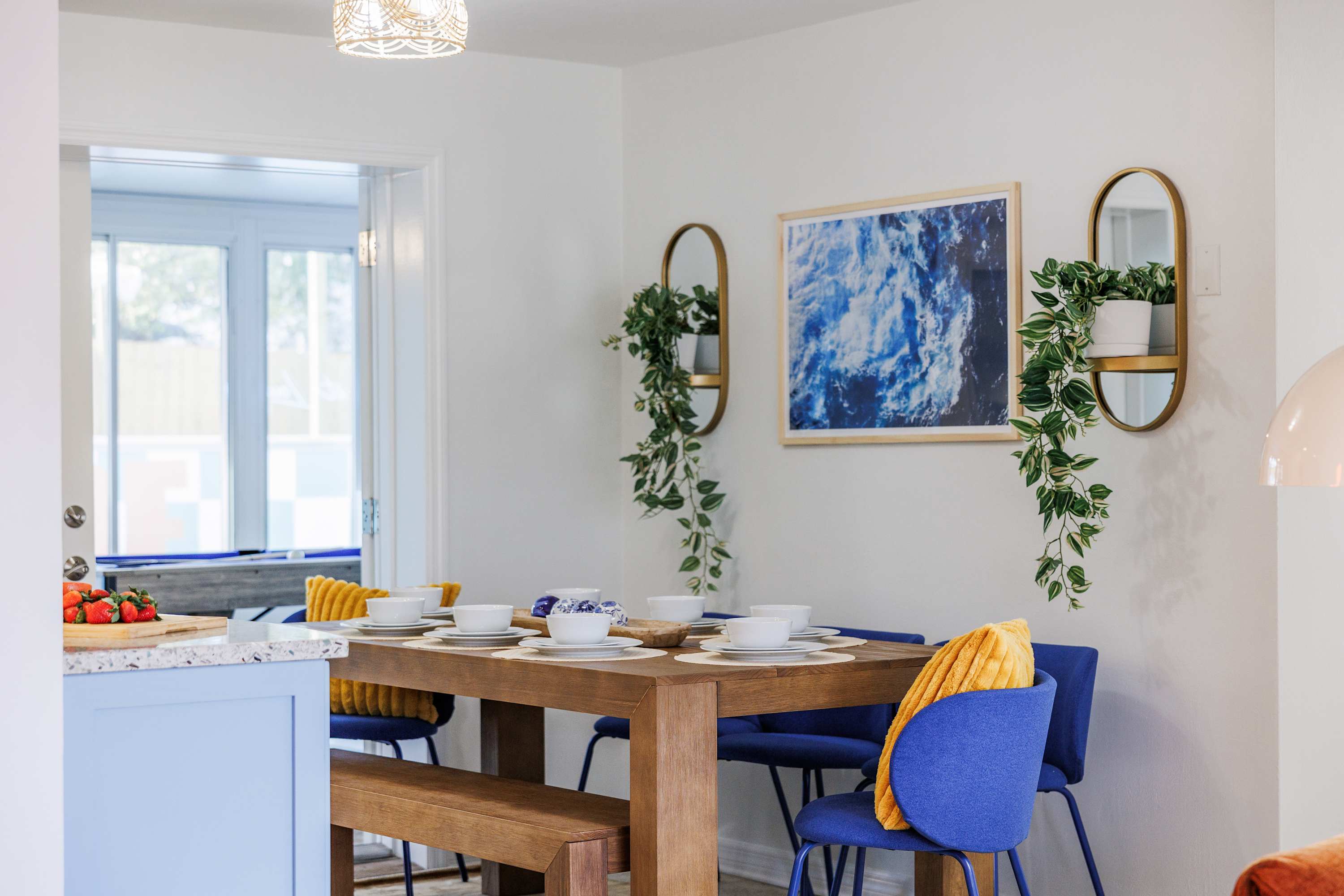 Dining nook w/ wood table, natural light, and an easygoing feel.