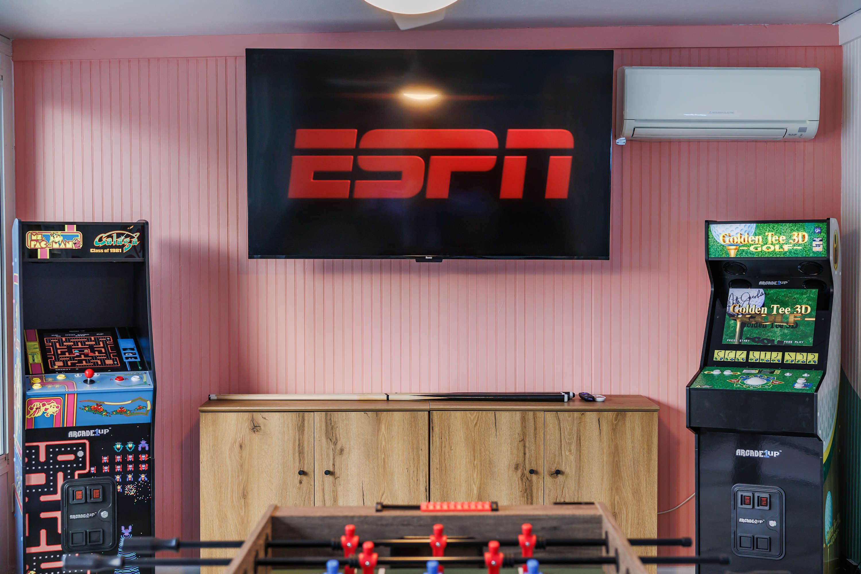 Lounge area w/ large TV and seating, ideal for movie or game nights.