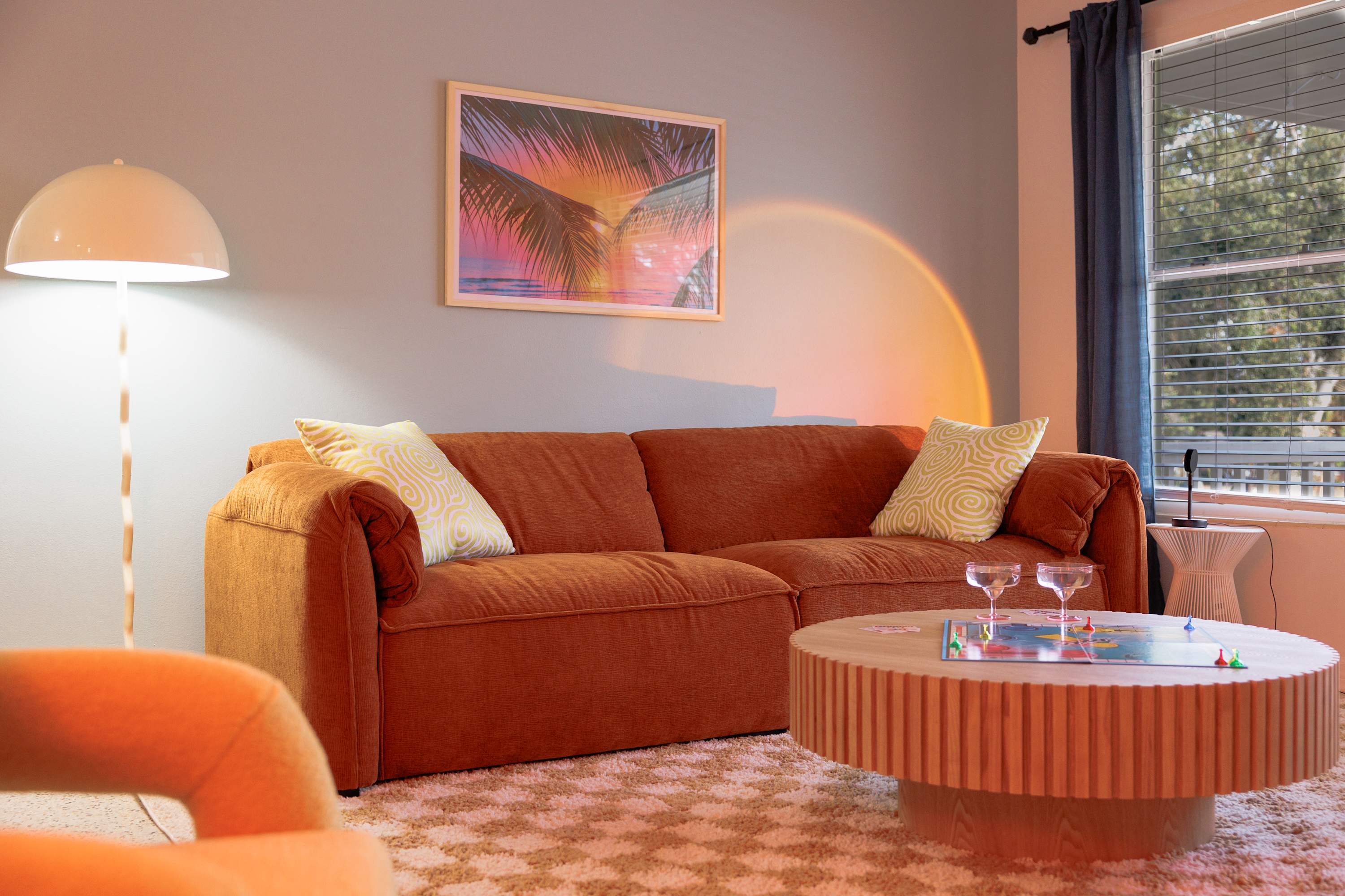 Inviting sitting area w/ warm tones and a relaxed, comfortable setup.