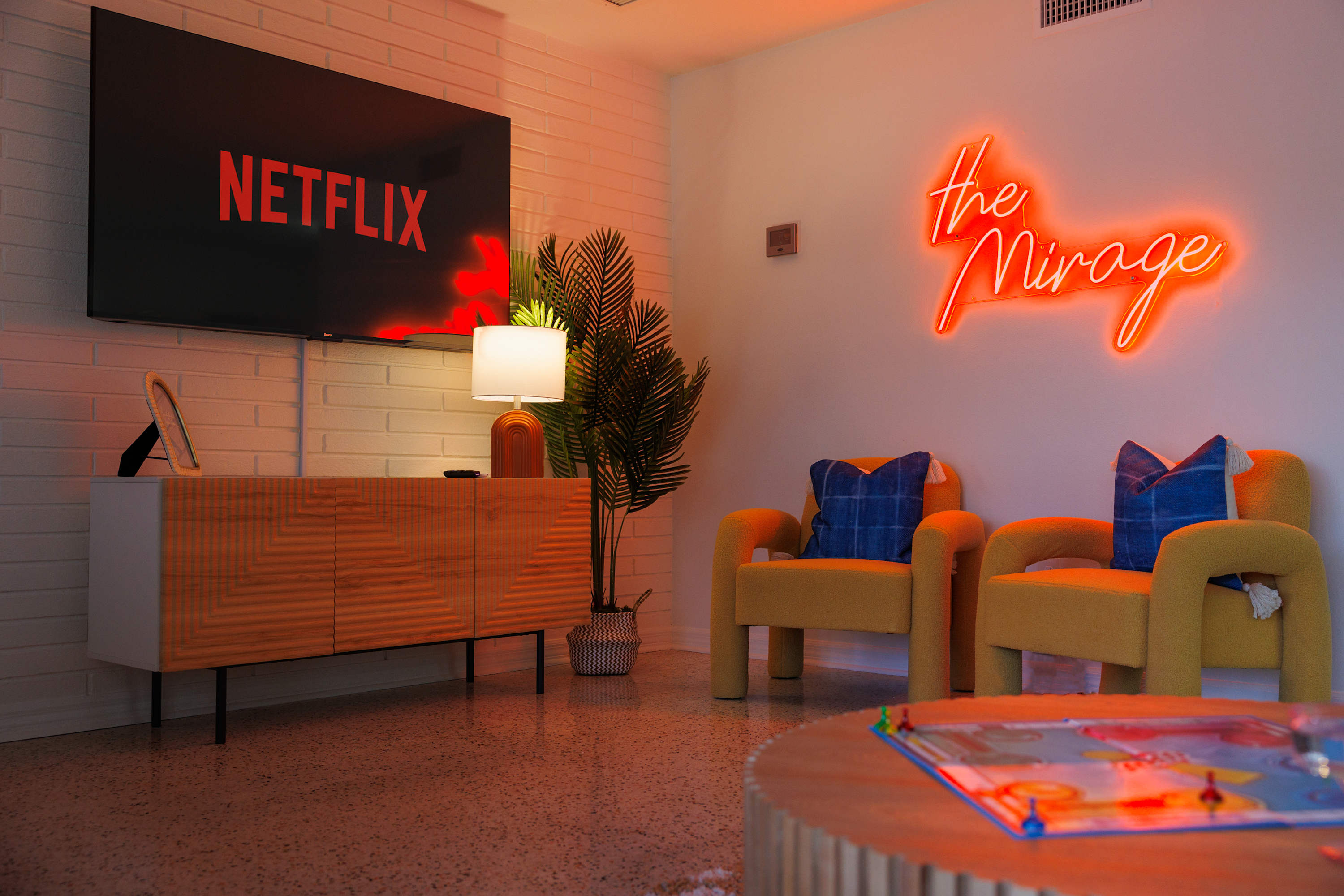 Neon-lit lounge corner that sets a lively, after-dark atmosphere.